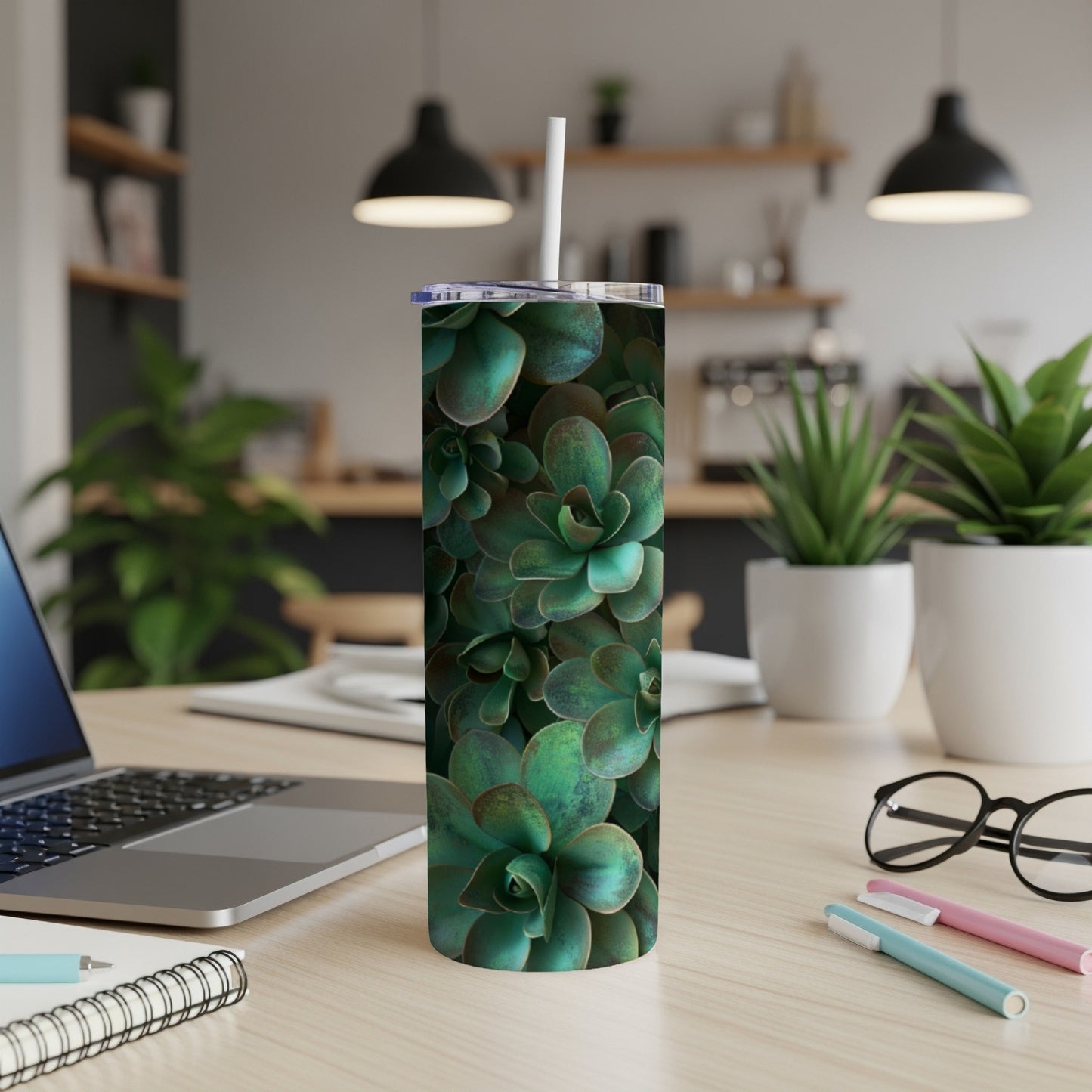Succulent plant pattern on a stainless steel tumbler with straw.