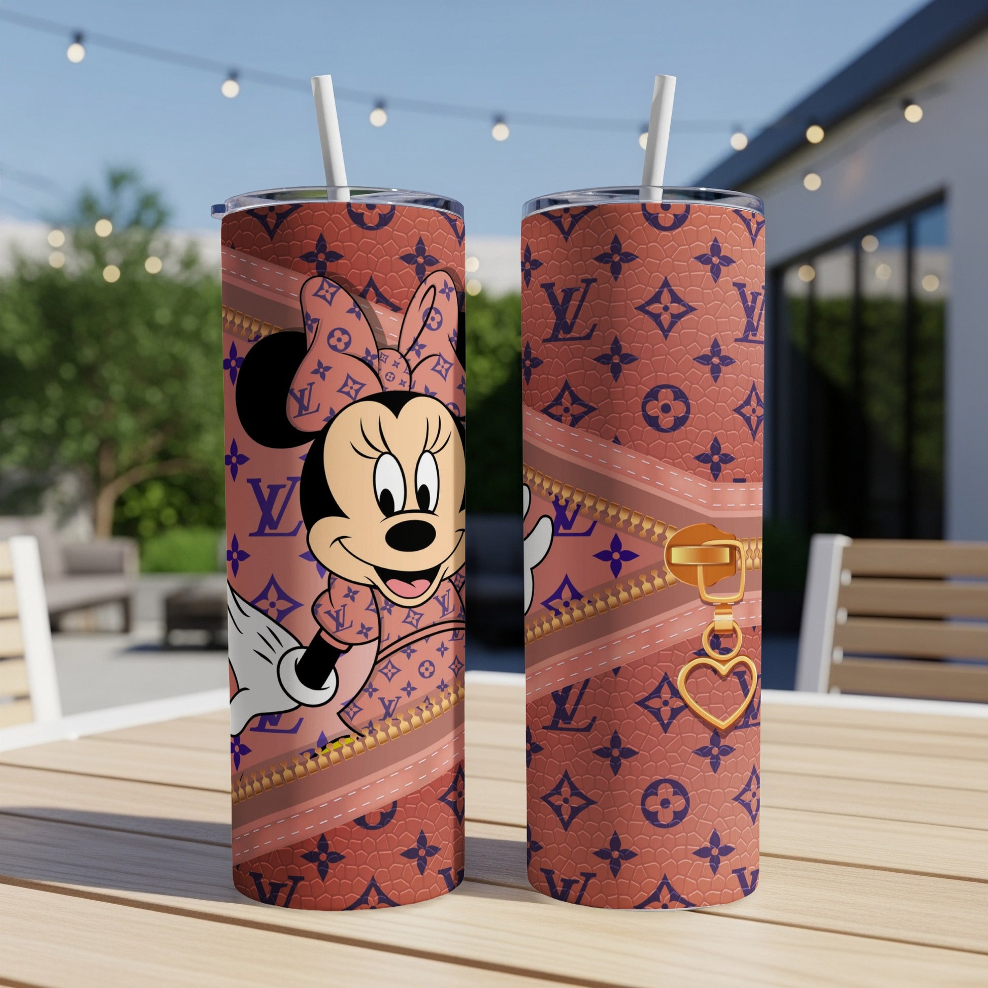 Minnie Mouse on a brown LV monogram tumbler with gold zipper detail.