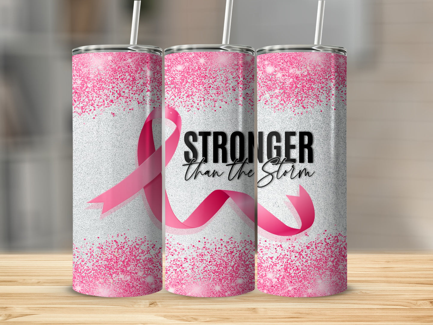 Pink ribbon tumbler with "Stronger Than The Storm" text.