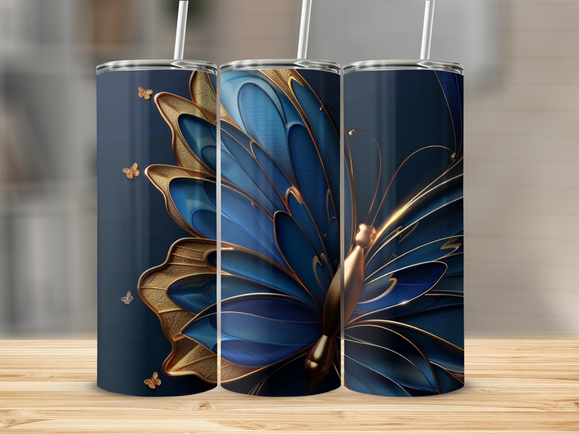 Three tumblers featuring a large blue and gold butterfly design.