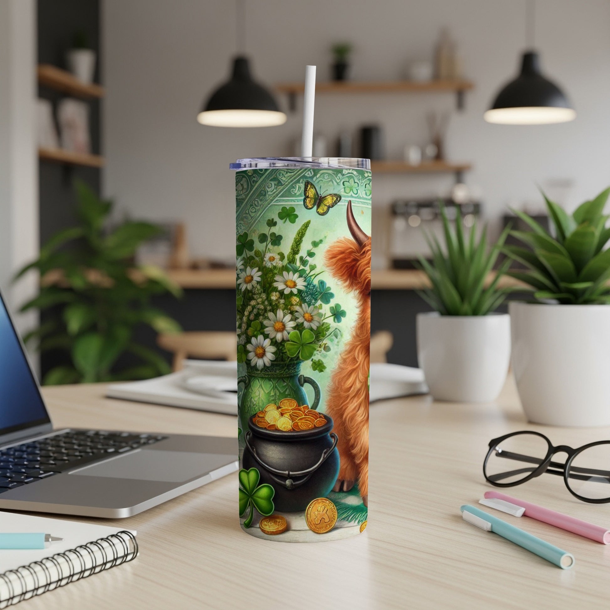 Highland cow, shamrocks, and pot of gold design on a white tumbler with straw.
