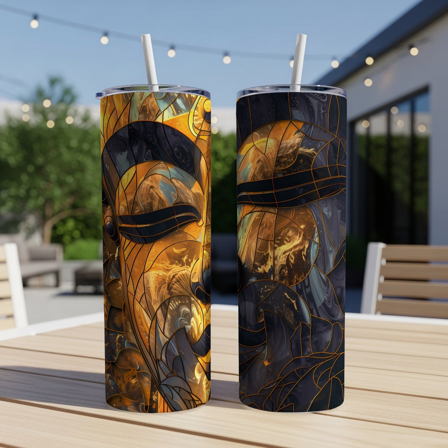 Two tumblers with abstract golden and black stained-glass-style faces.