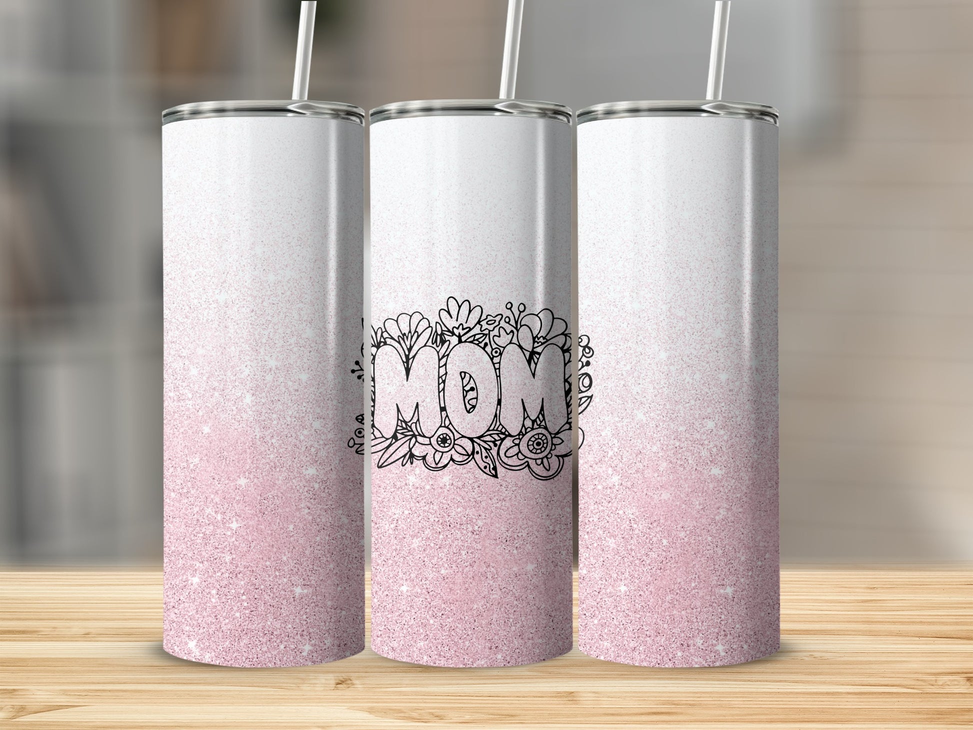 Three tumblers with pink glitter and "Mom" floral design.