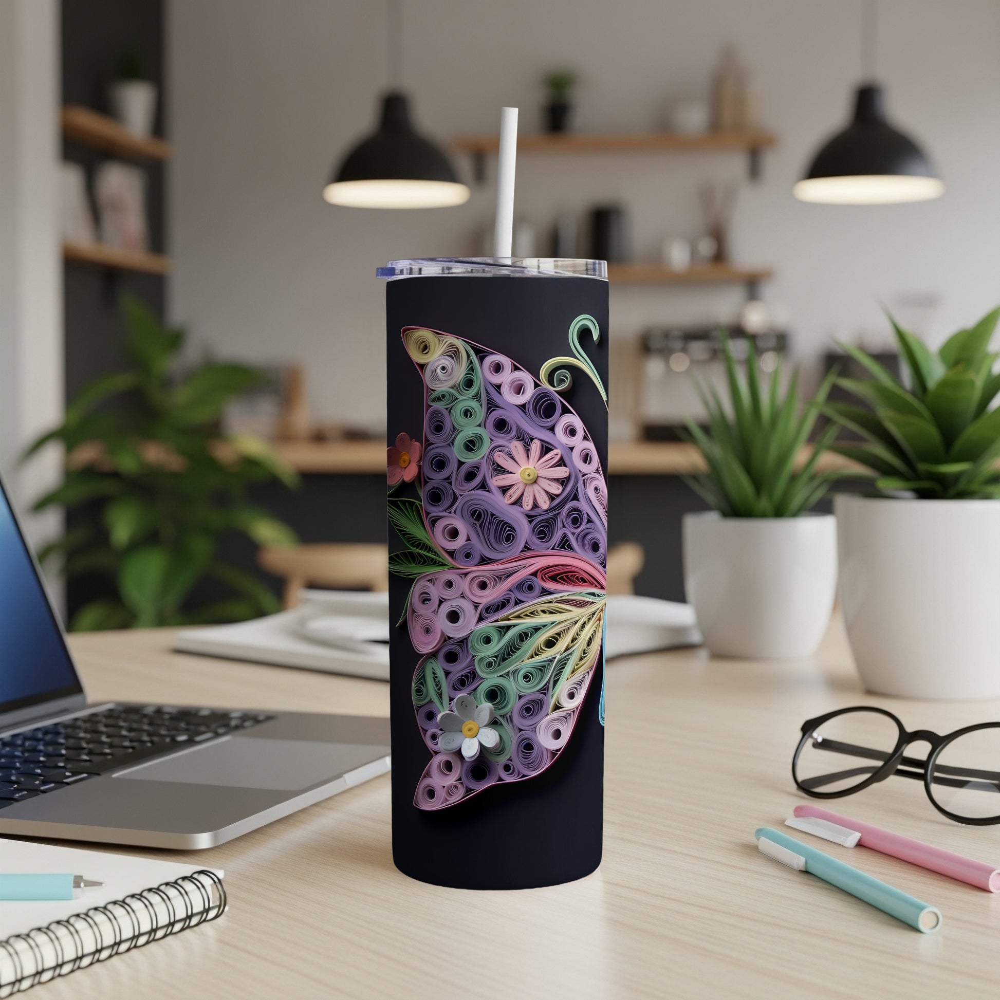 Black tumbler with a colorful paper quilled butterfly design and a white straw.