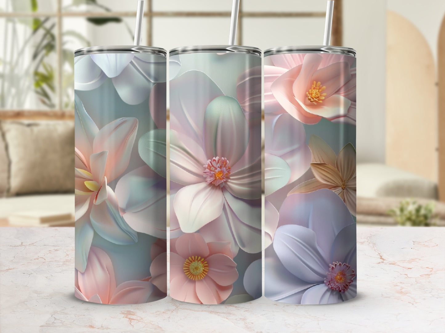 Three tumblers with large pastel floral designs in a soft focus background.