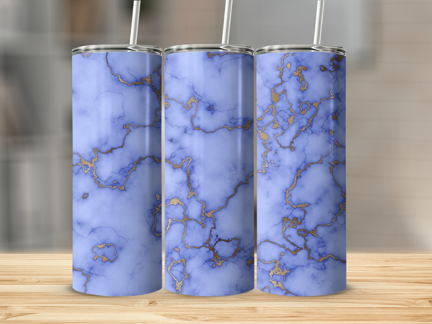 Three tumblers with blue marble and gold veining pattern.