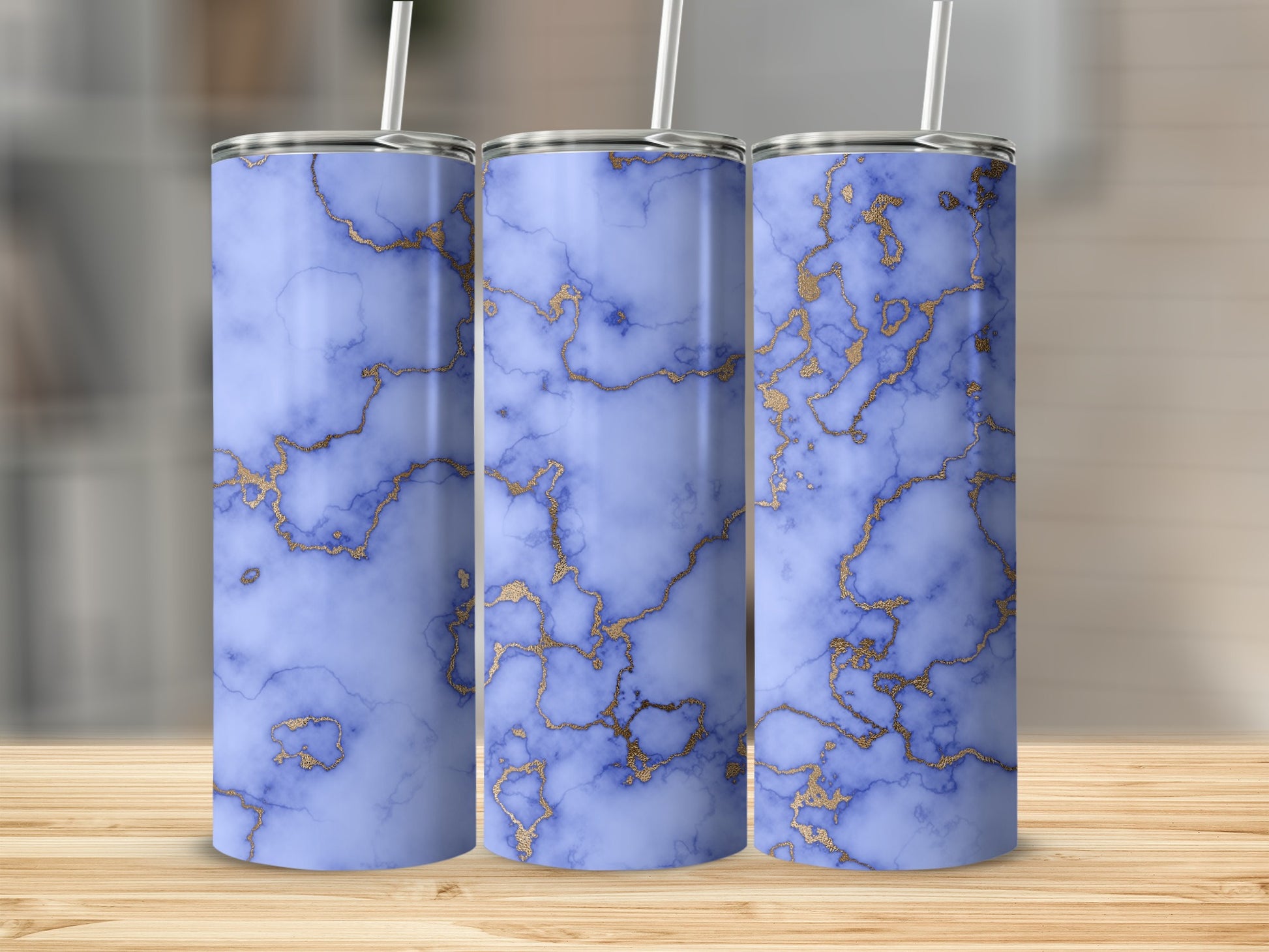 Three tumblers with blue marble and gold veining pattern.