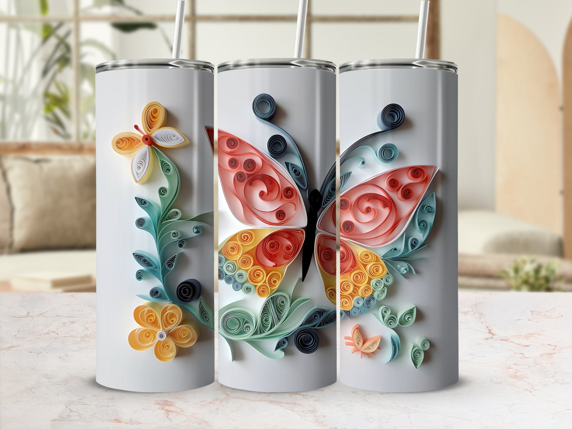 Tumblers decorated with colorful quilled butterflies and flowers.