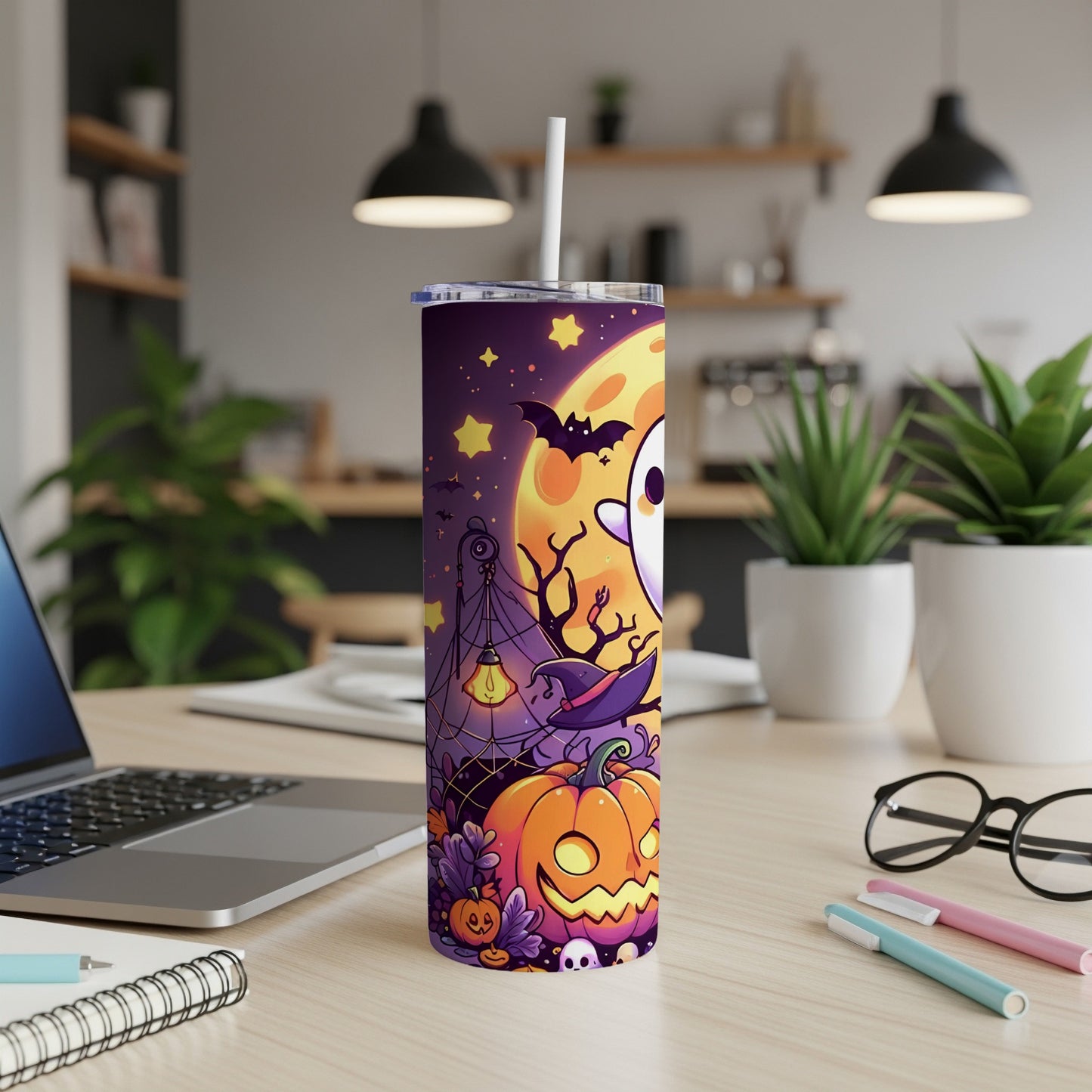Tall tumbler with Halloween ghost, pumpkin, bat, and moon design.