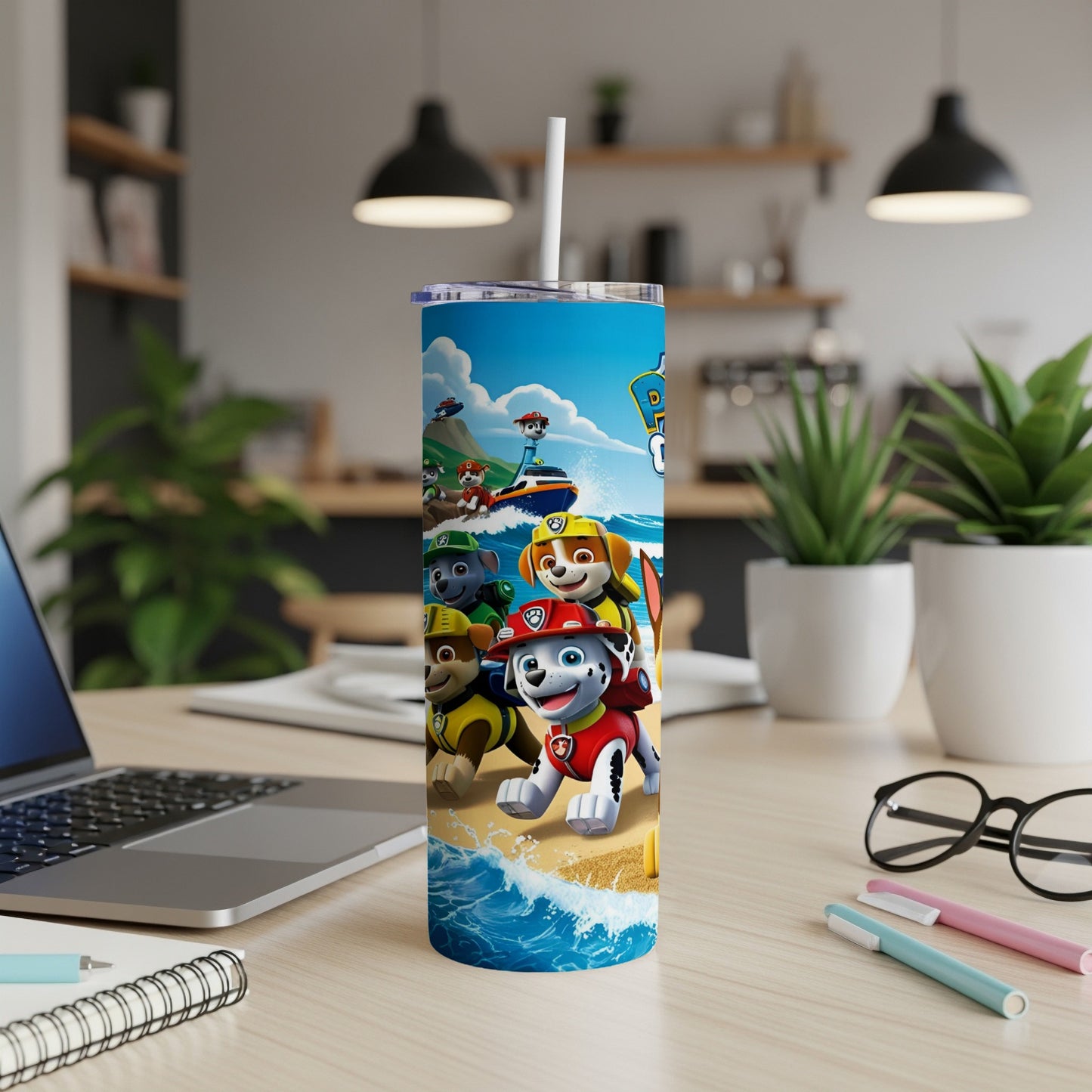Paw Patrol characters on a beach scene wrap around a white tumbler.