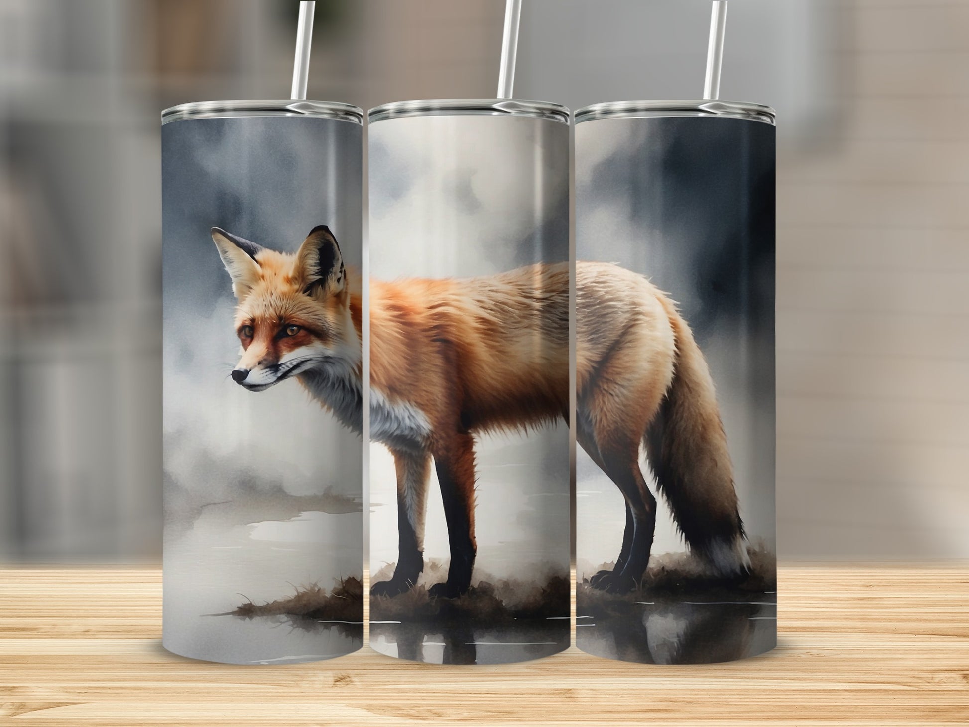 Three tumblers featuring a watercolor-style fox in a misty landscape.