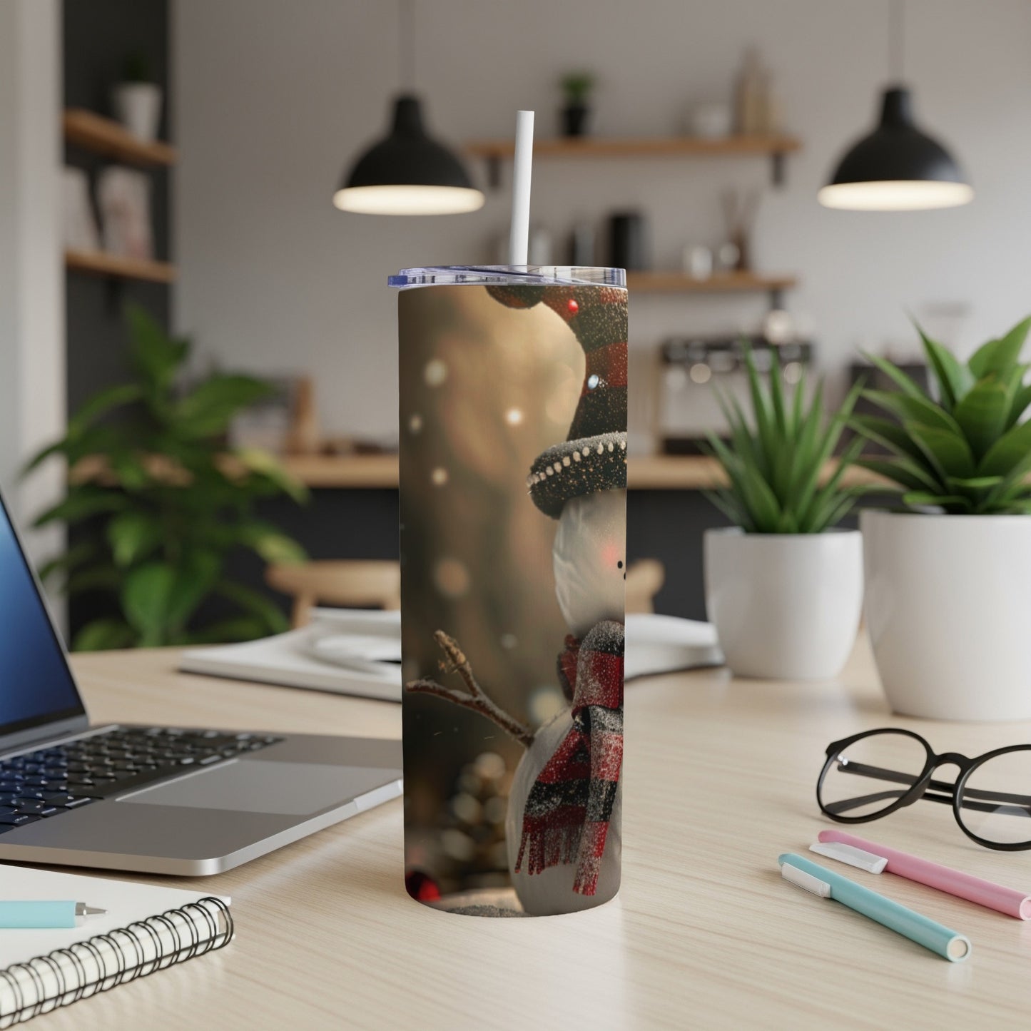 Tall tumbler with snowman design, red plaid scarf, black hat, and straw.