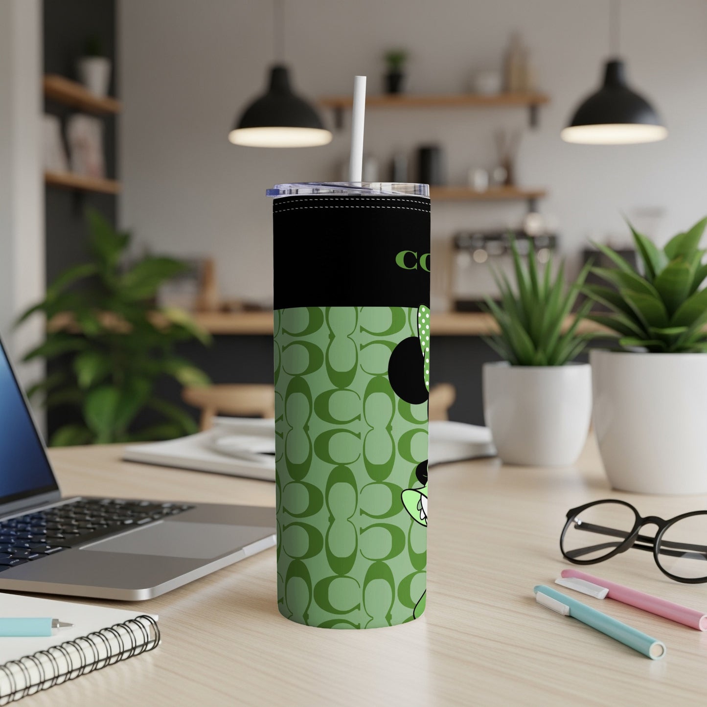 Green tumbler with all-over 'C' logo pattern and Mickey Mouse design.