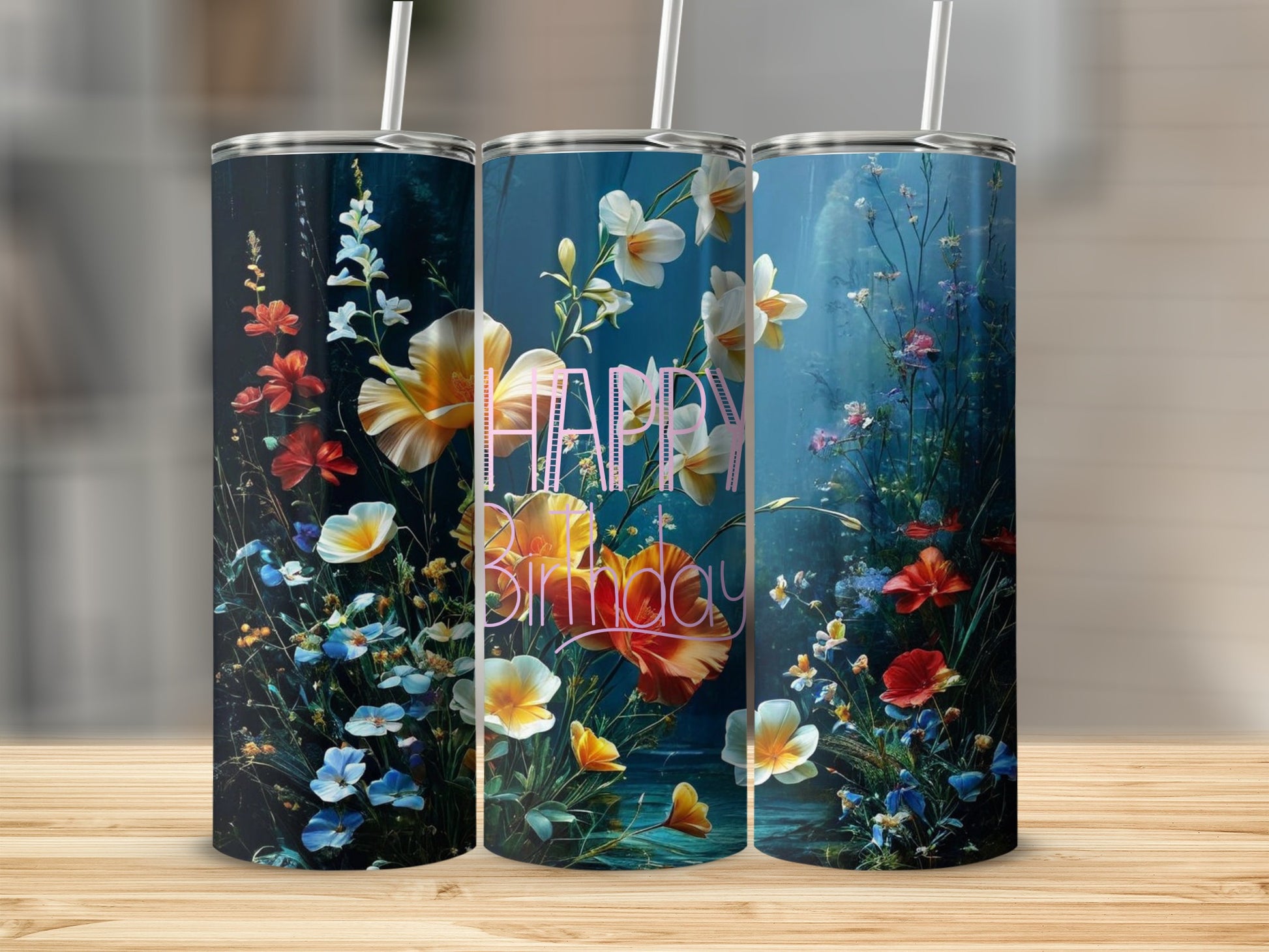 Three tumblers with vibrant floral designs and "Happy Birthday" text.