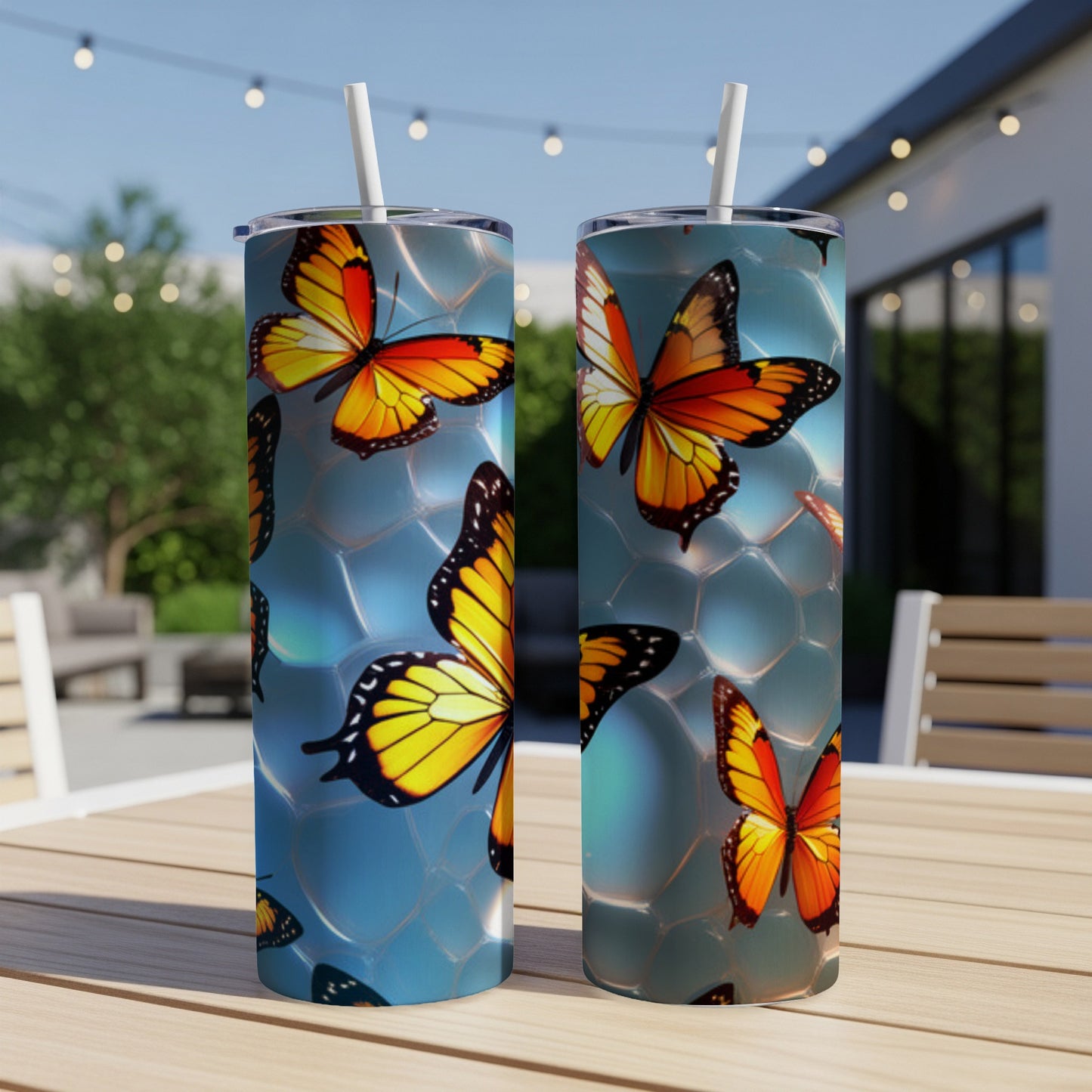 Two tall tumblers with orange and black butterflies on a blue, bubbly background.