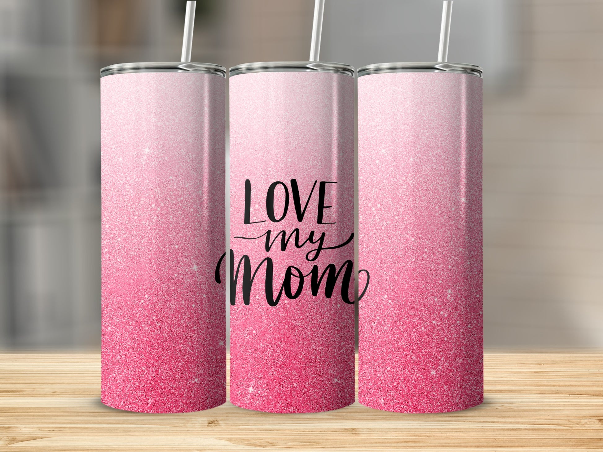 Tall tumbler with pink glitter gradient and "LOVE my mom" text.