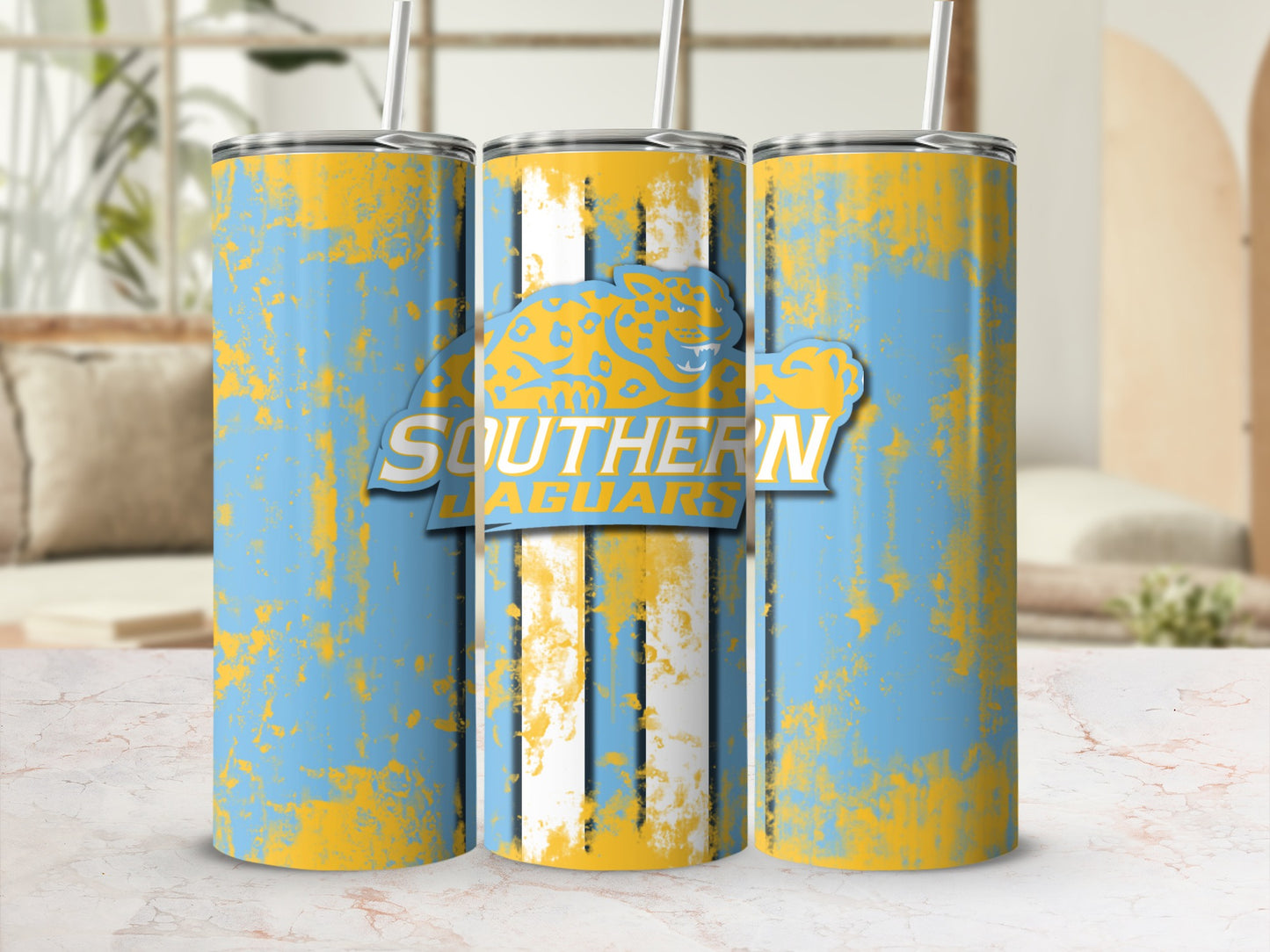 Tumblers with a distressed sky blue and yellow design and "Southern Jaguars" logo.