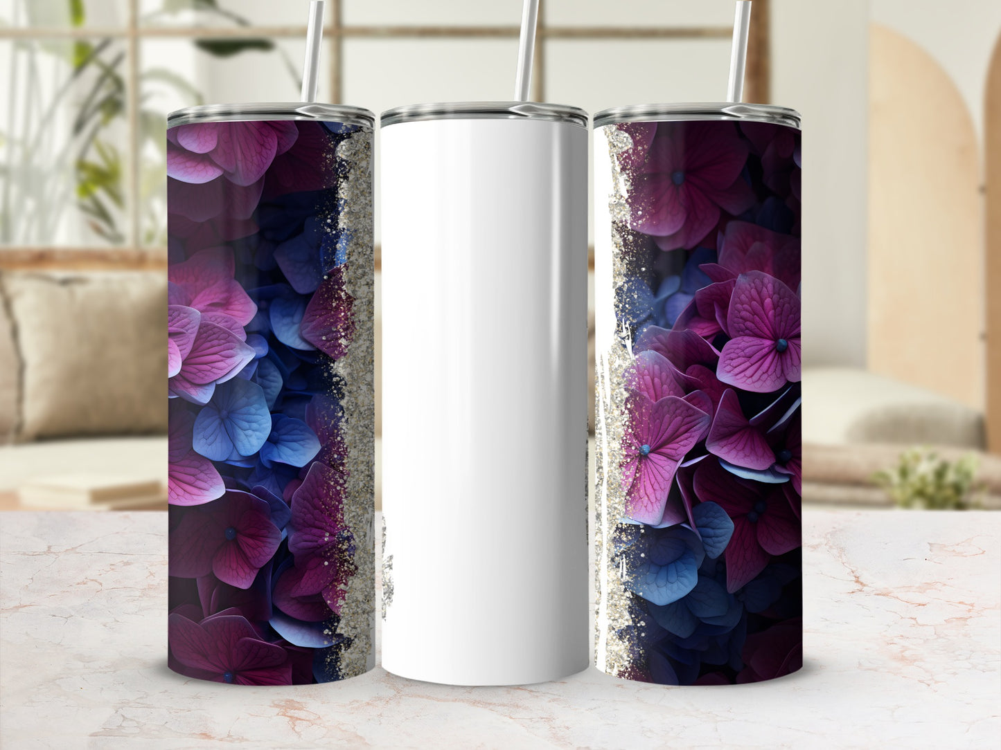 White tumbler with purple and blue floral design and glitter accents.