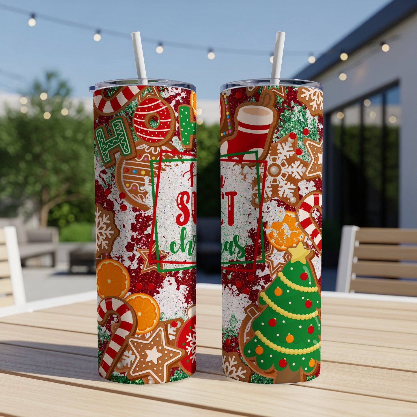 Two Christmas-themed tumblers with gingerbread, candy canes, and oranges.