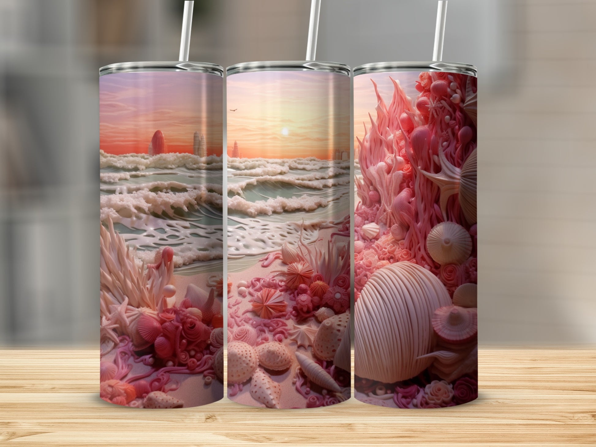 Three tumblers with coral and seashell designs against a beach sunset scene.