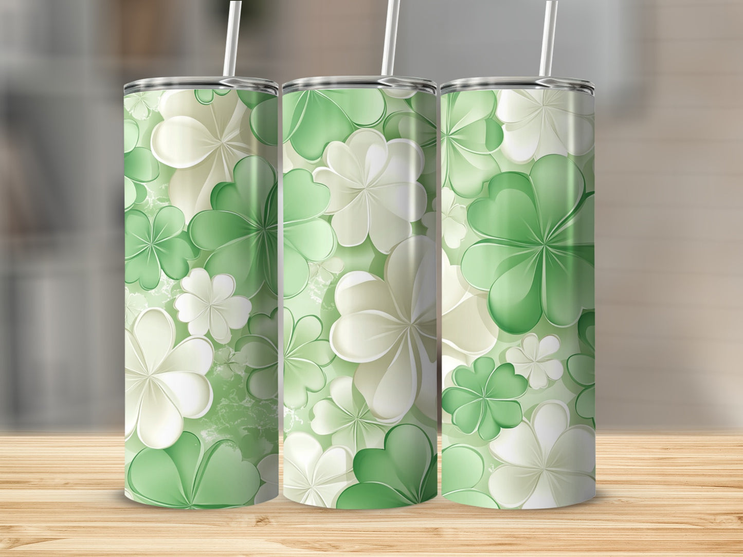 Three tumblers with a green and white clover pattern.