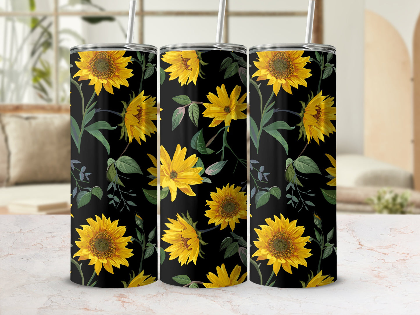 Three tumblers with a black background and a repeating sunflower floral pattern.