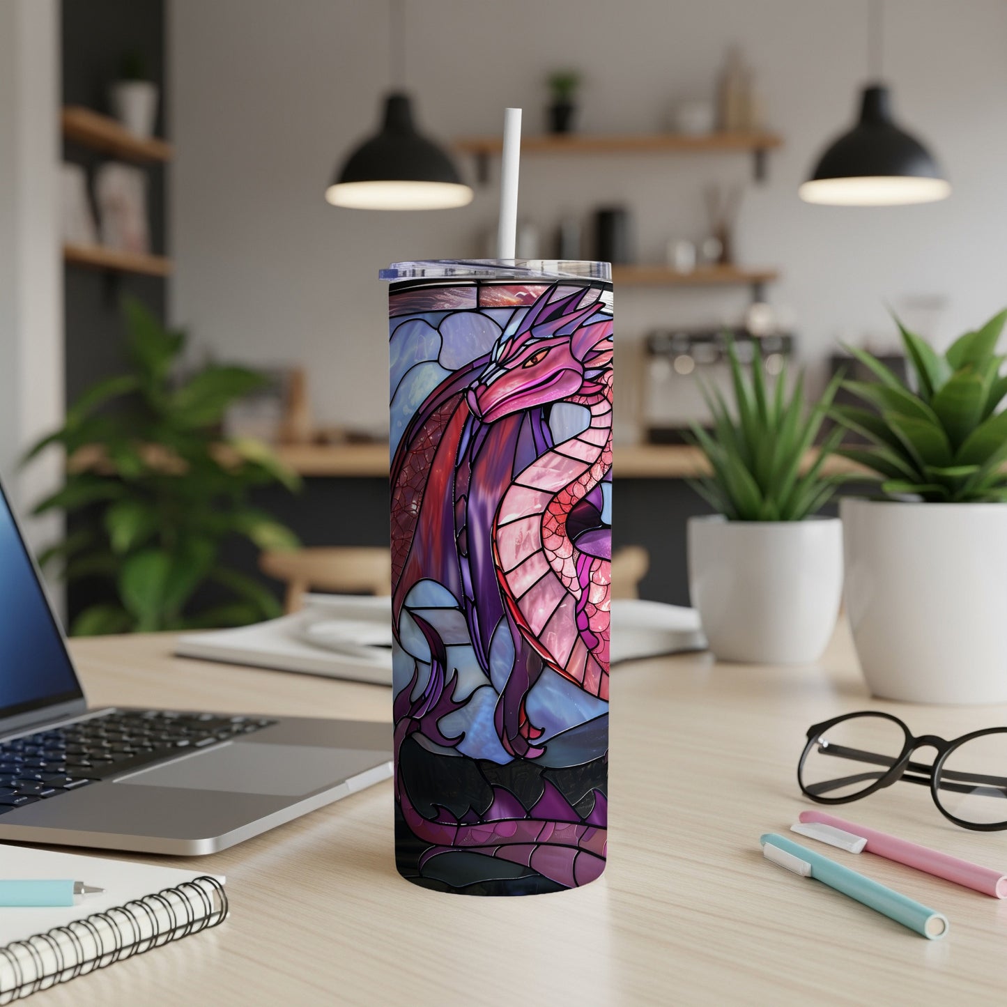 Dragon tumbler with stained glass design on a desk.