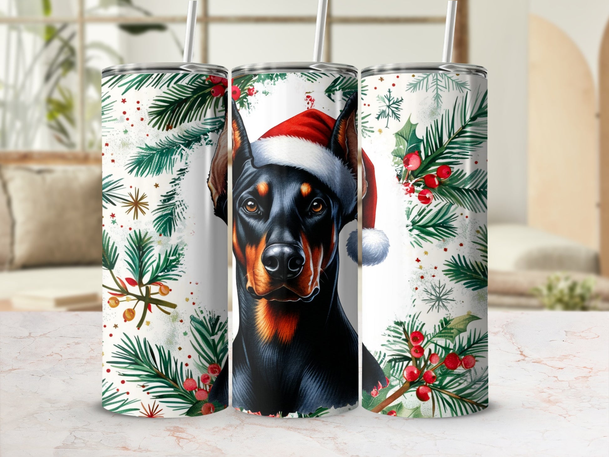 Doberman wearing a Santa hat surrounded by holly and pine branches.