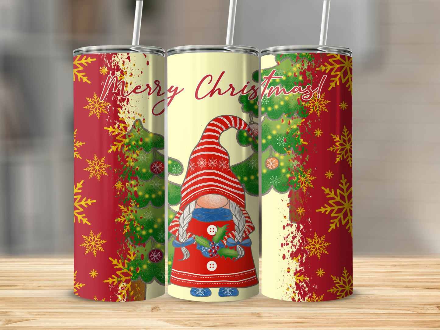 Christmas gnome tumbler with snowflakes and trees on a wooden surface.