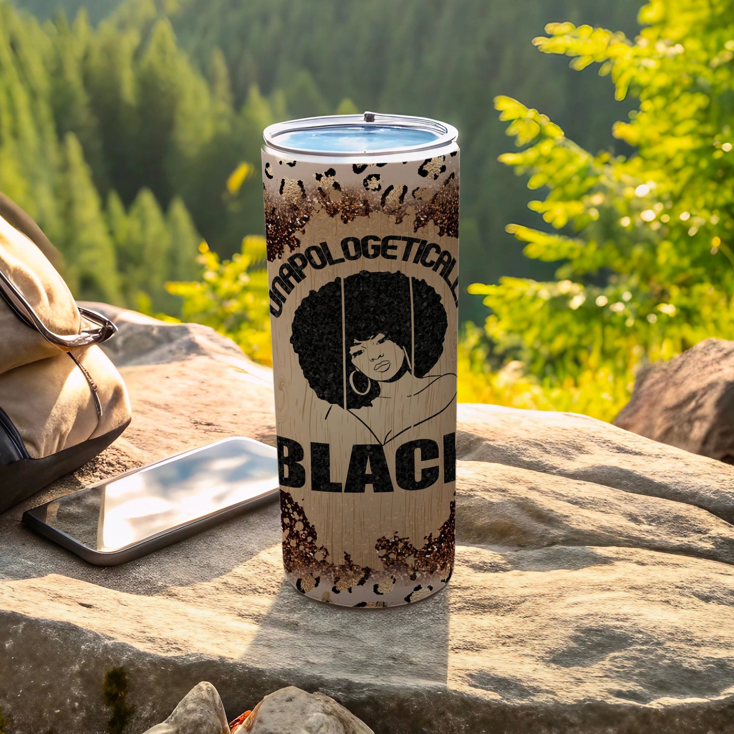 Tumbler with "Unapologetically Black" text and a woman's silhouette.