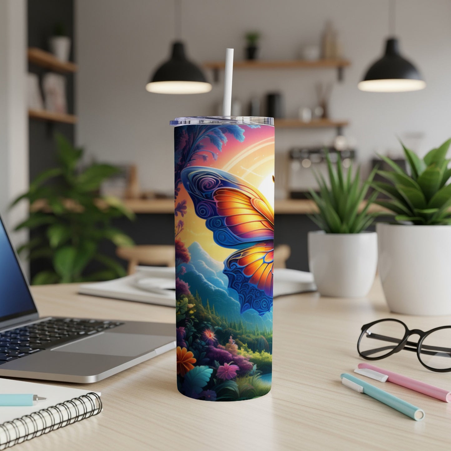 Colorful butterfly design on a stainless steel tumbler with a straw.