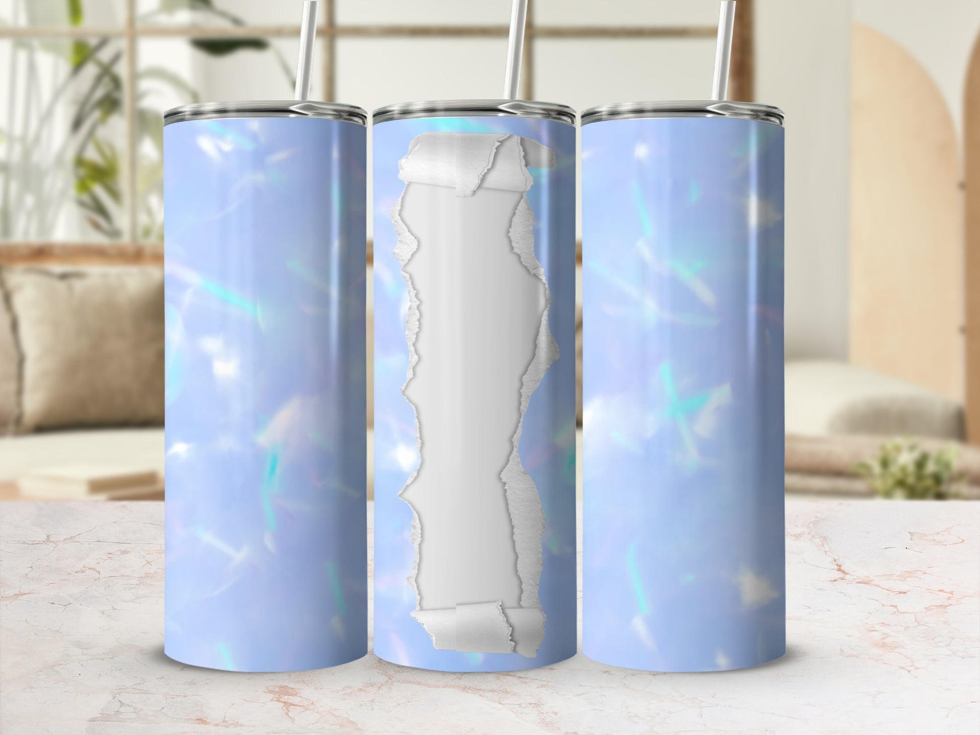 Three light blue holographic tumblers with torn paper effect on a marbled surface.