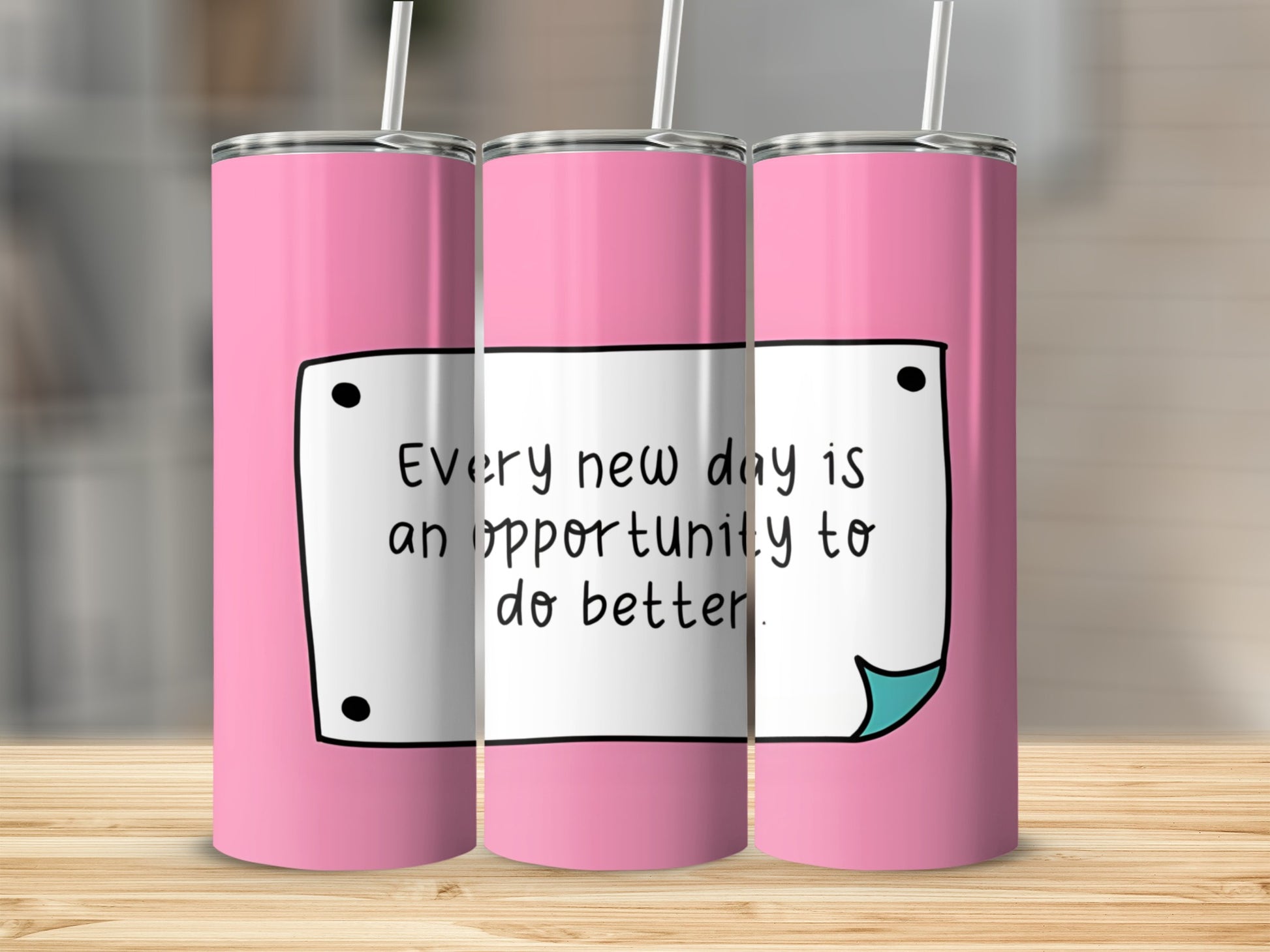 Pink tumbler with "Every new day is an opportunity to do better" text.