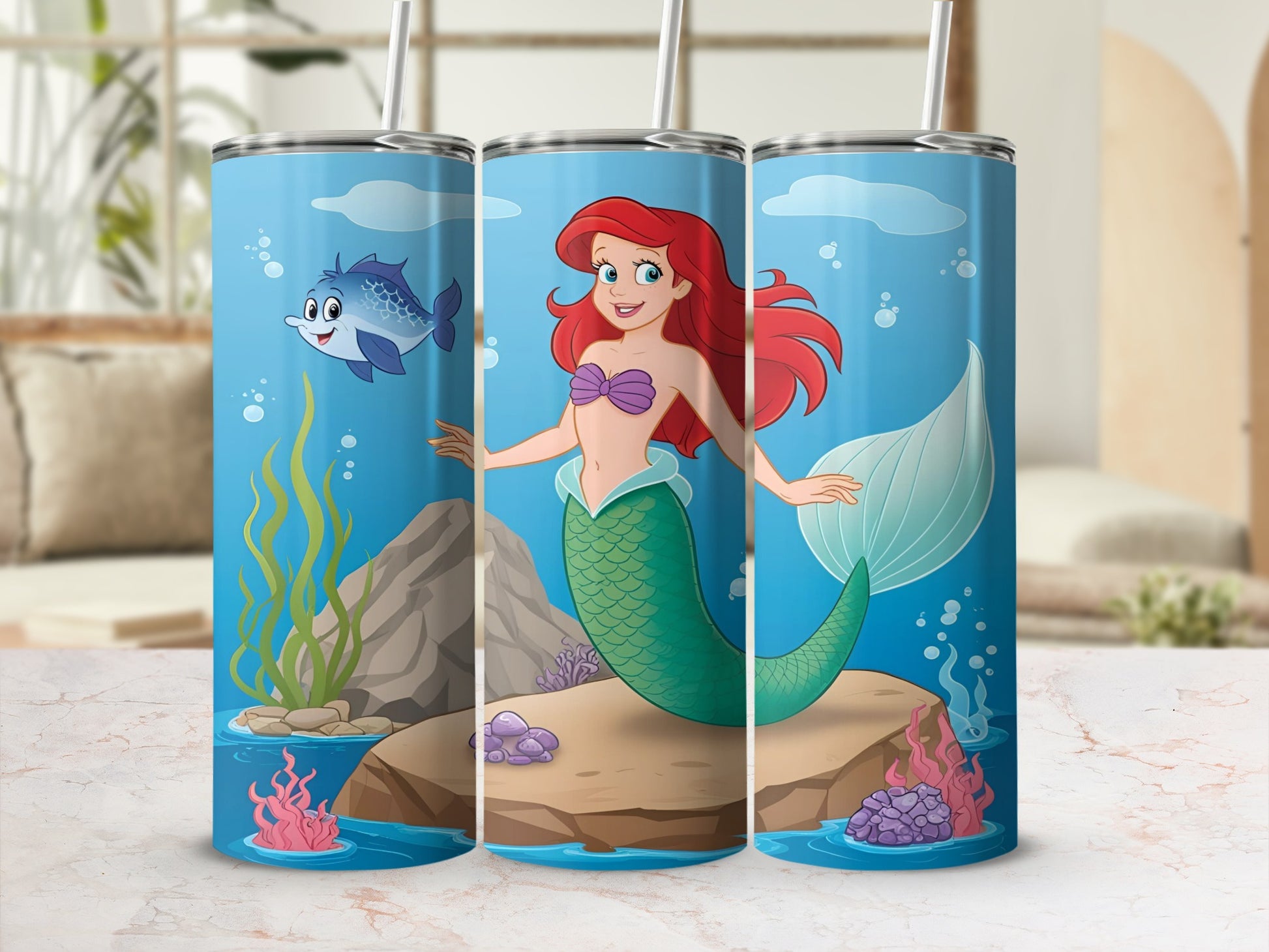Ariel the mermaid on a rock with a fish swimming by.
