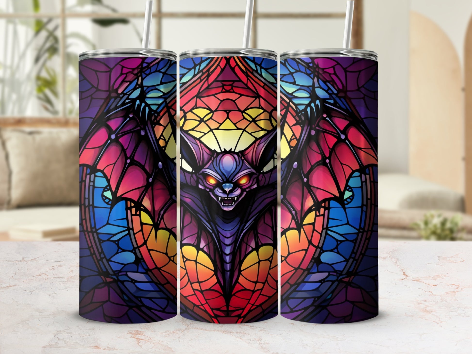 Stained glass bat design on three tumblers with straws.