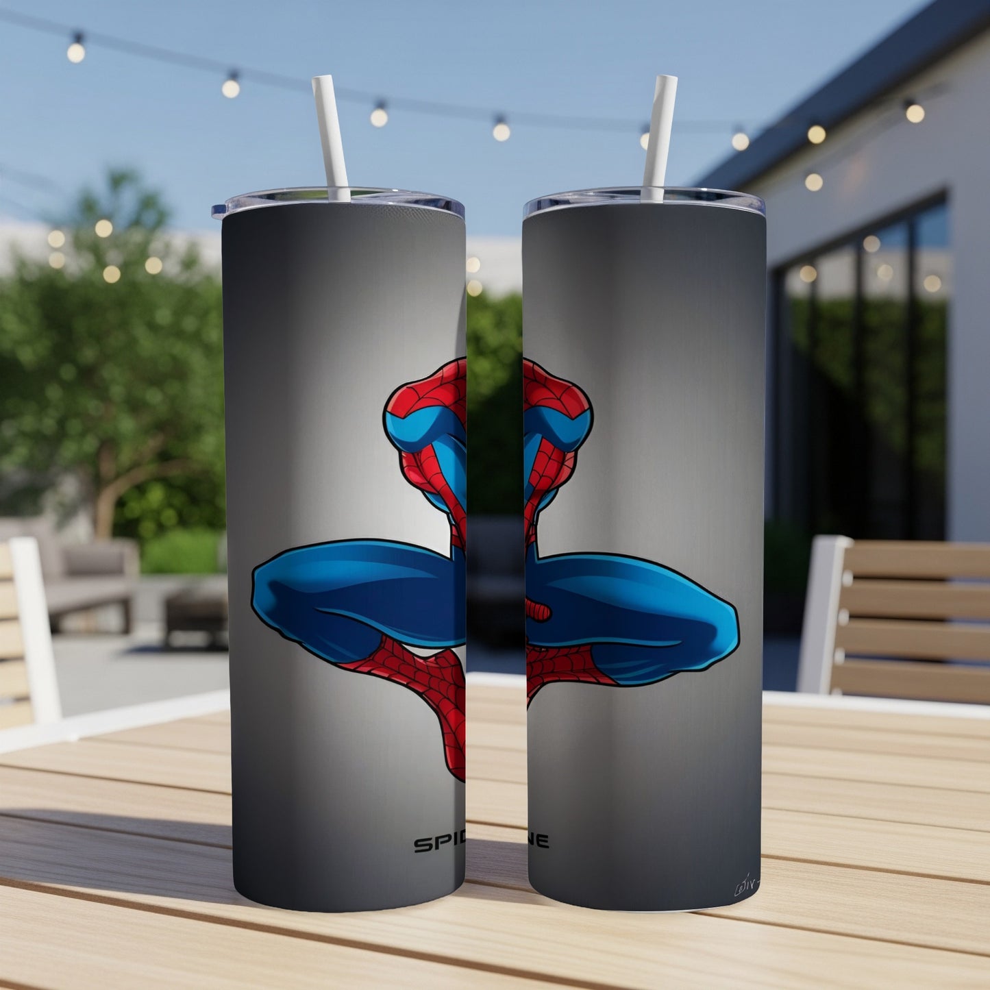 Spider-Man artwork on two grey tumblers with straws, outdoors.