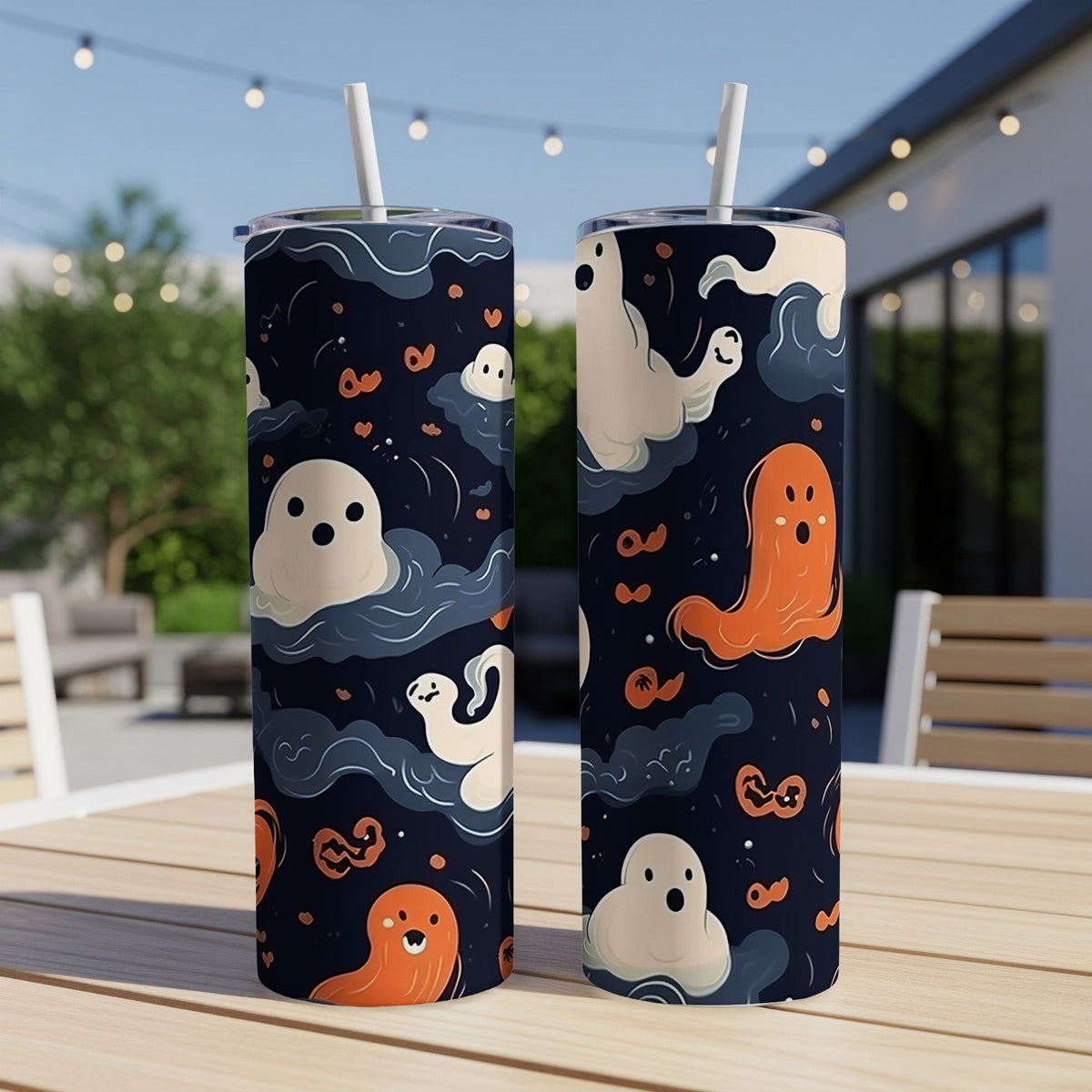 Tumblers with a dark blue background featuring a Halloween ghost and cloud pattern.