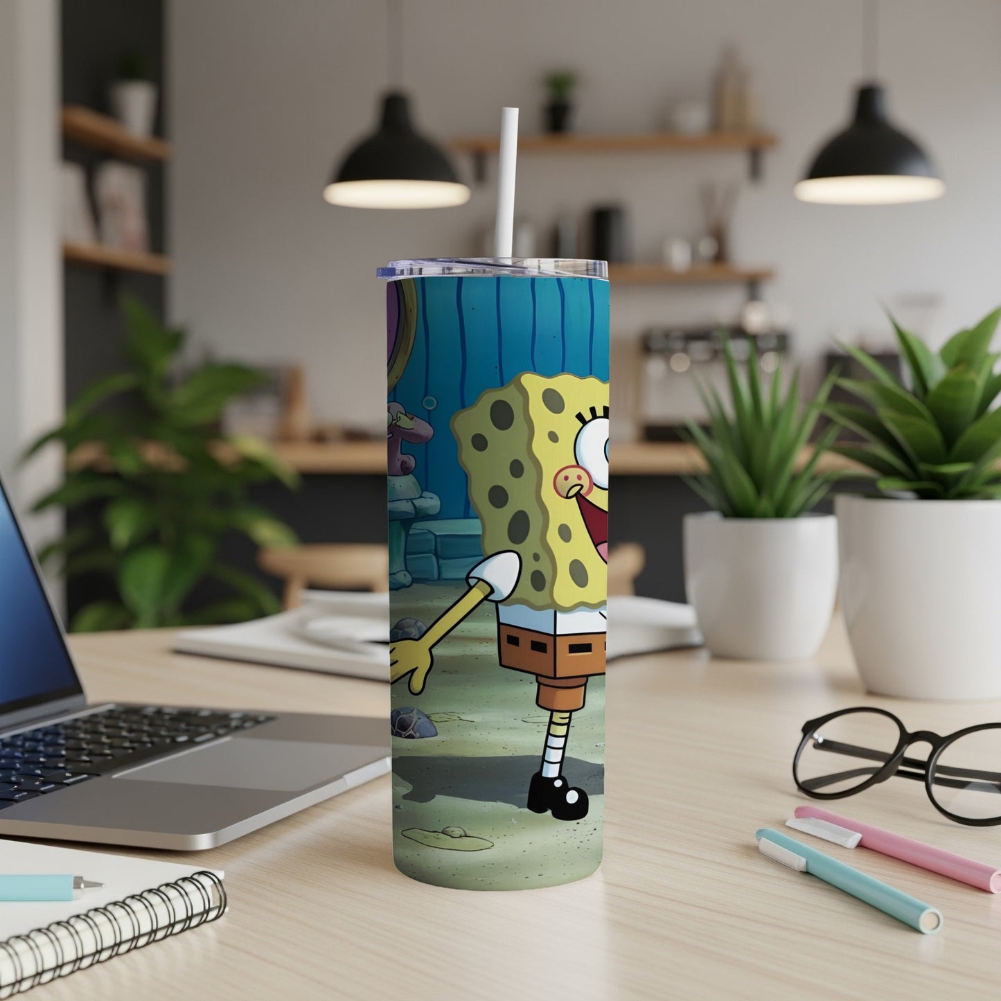 SpongeBob SquarePants cartoon character on a tumbler with a straw.