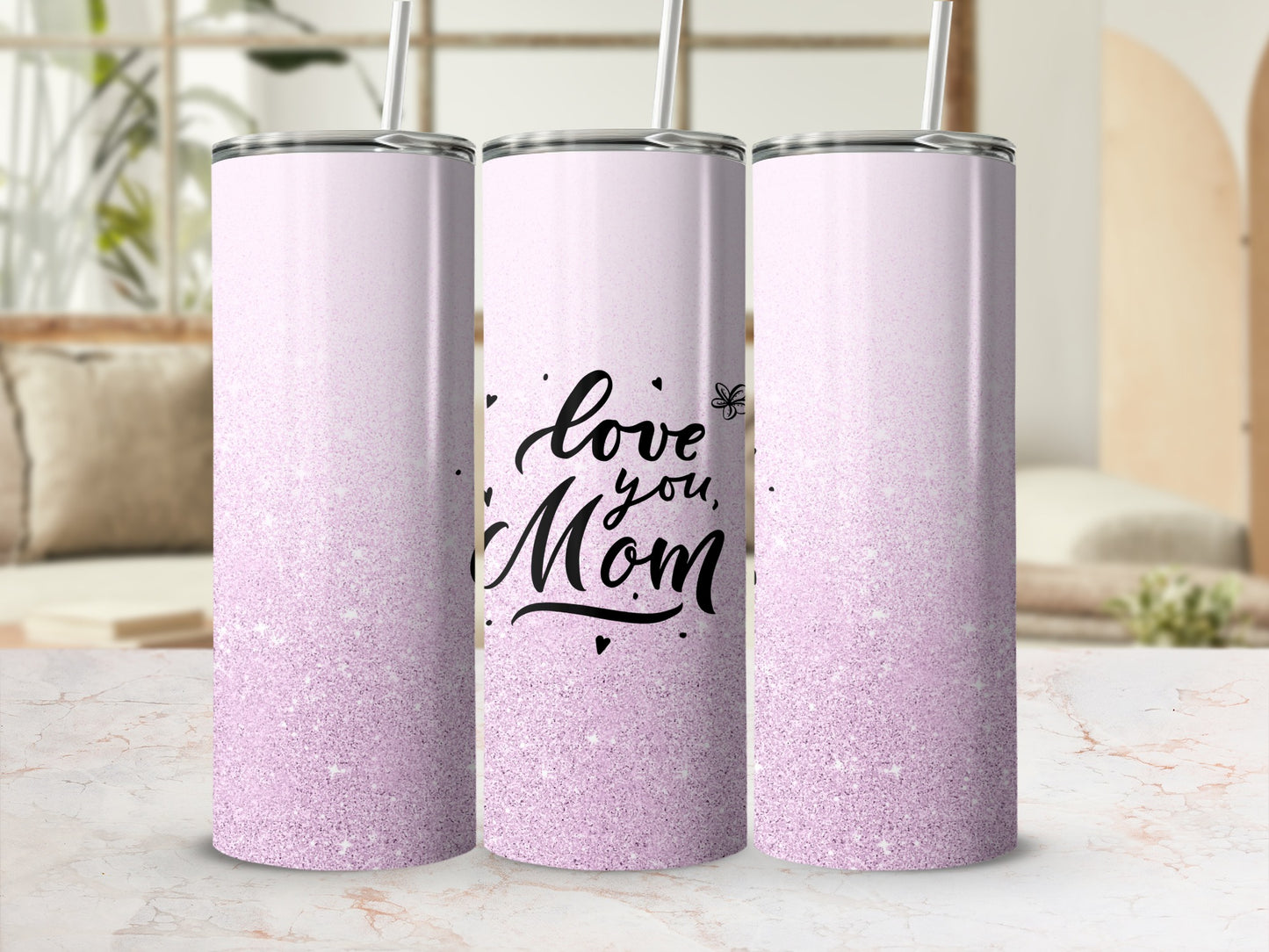 Pink glitter tumbler with "love you, Mom" text and straw.