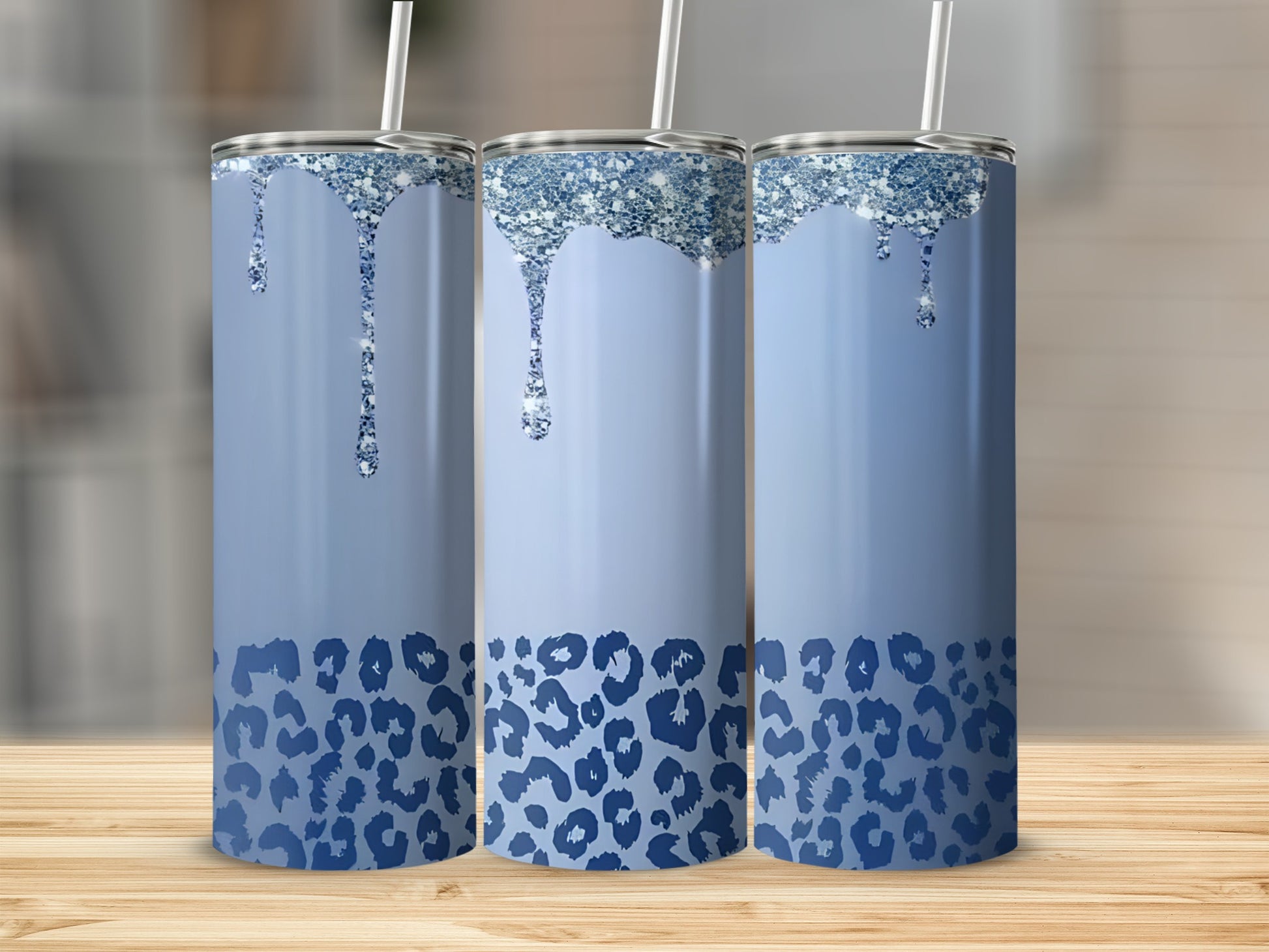Blue tumbler with glitter drips and leopard print.