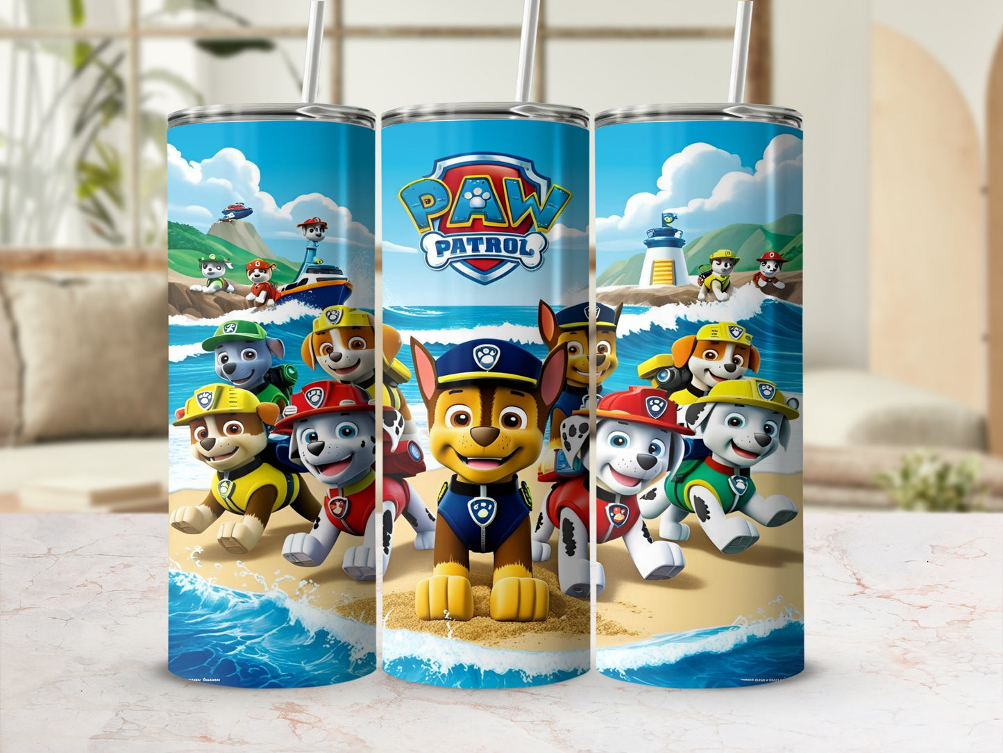 Paw Patrol characters Chase, Ryder, and Marshall on a beach.