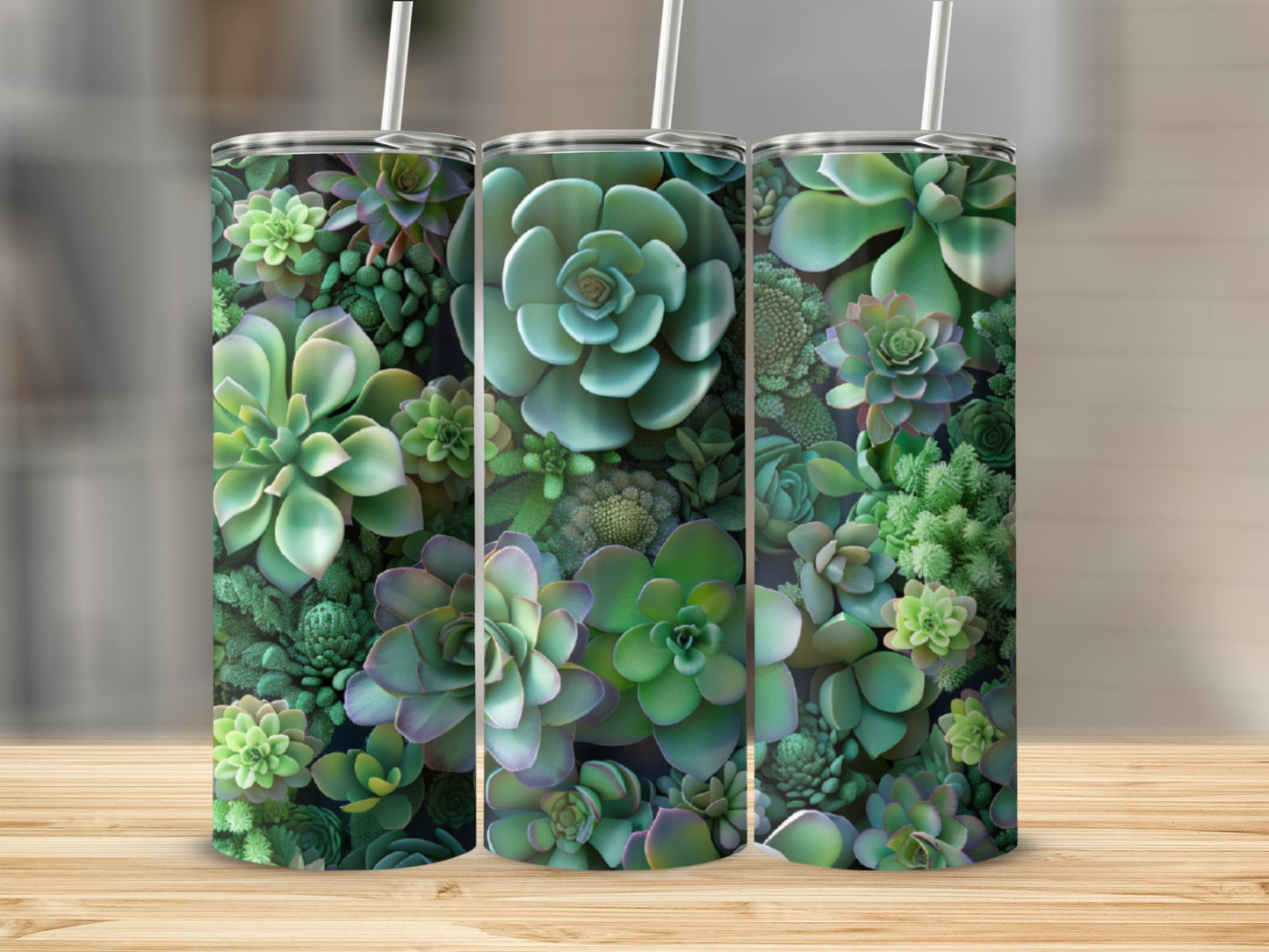 Three tumblers with succulent plant pattern on wooden surface.