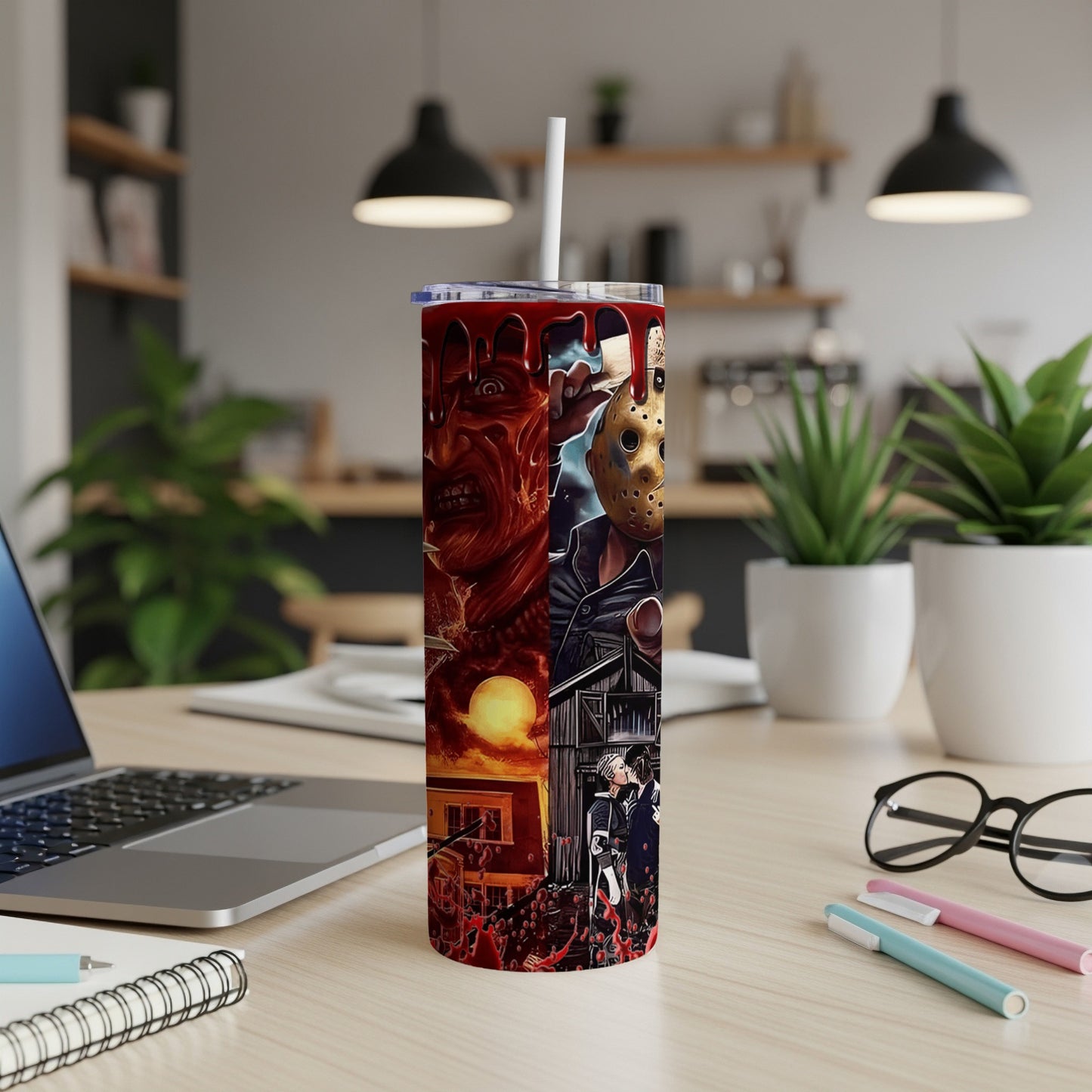 Tumbler with horror movie characters Freddy Krueger and Jason Voorhees, dripping blood.