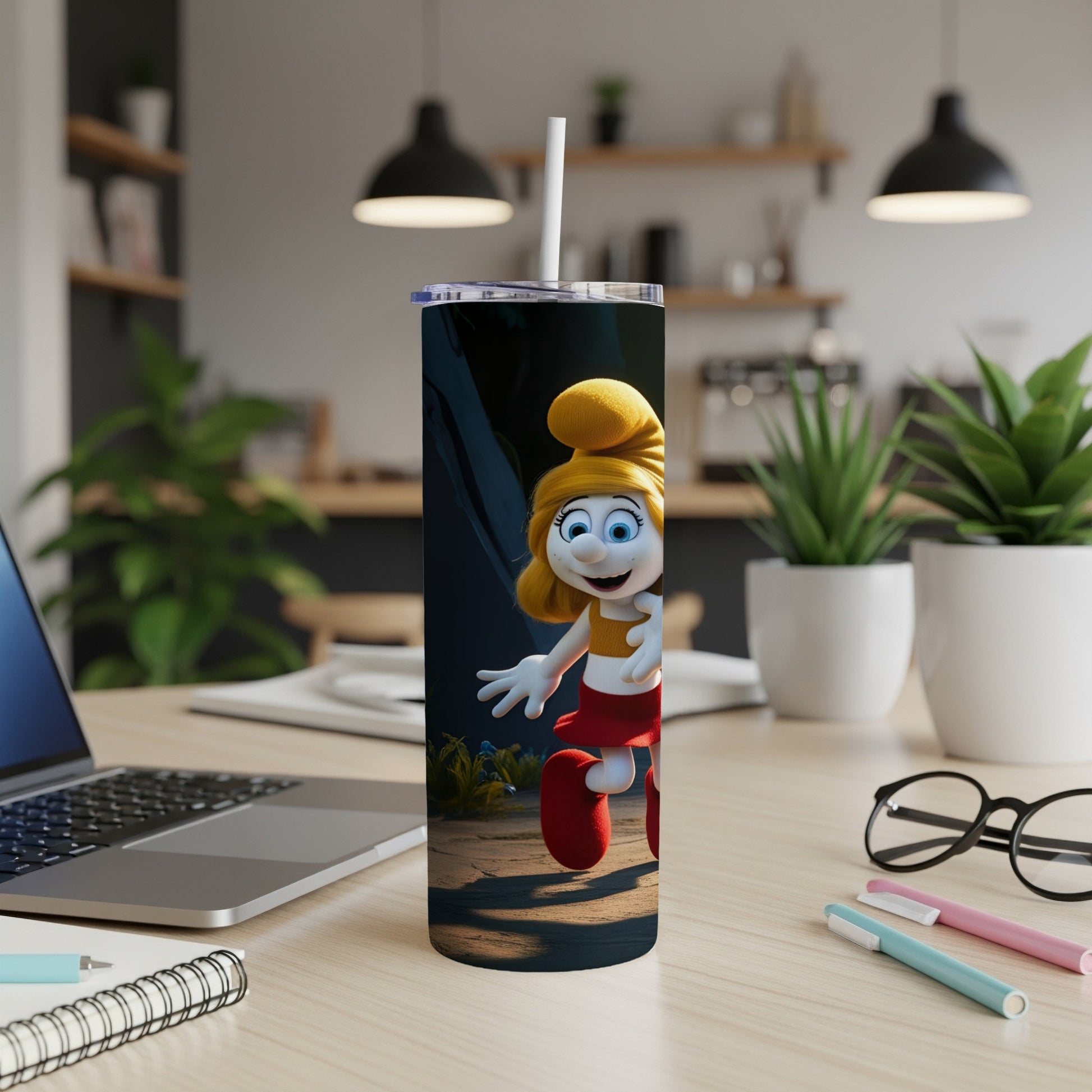 Smurfette character on a tumbler with a straw, on a wooden desk.