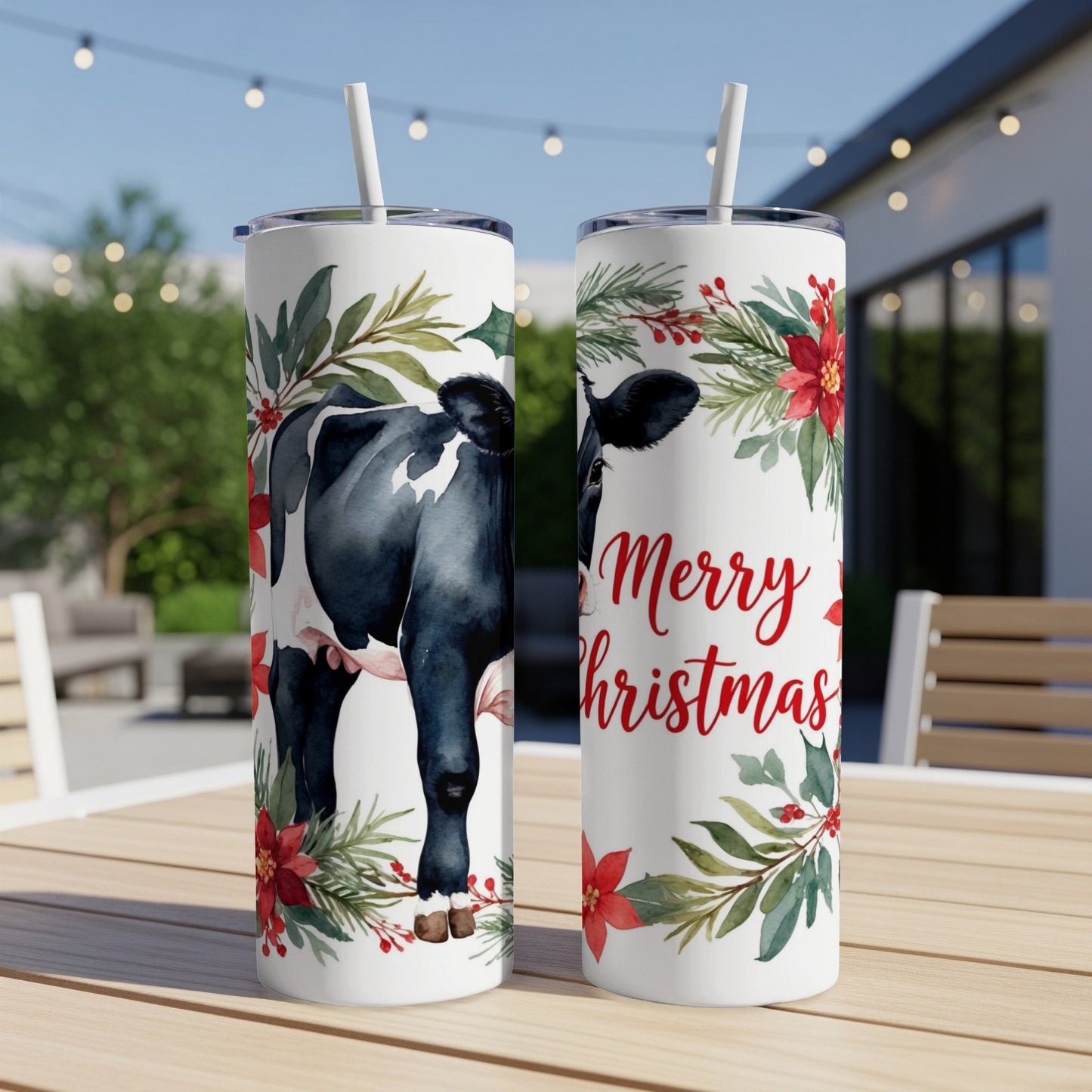 Black and white cow with Merry Christmas text on a tumbler.