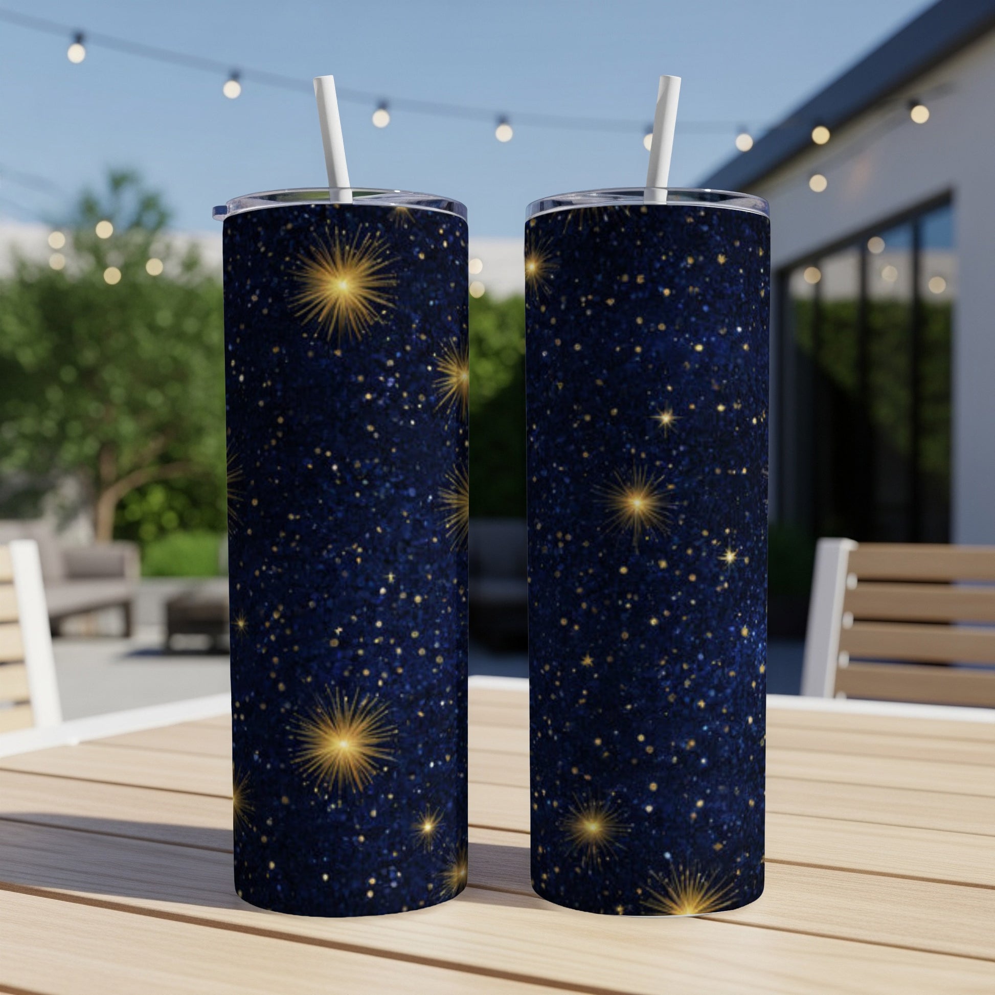 Two tall, dark blue tumblers with gold star glitter pattern.