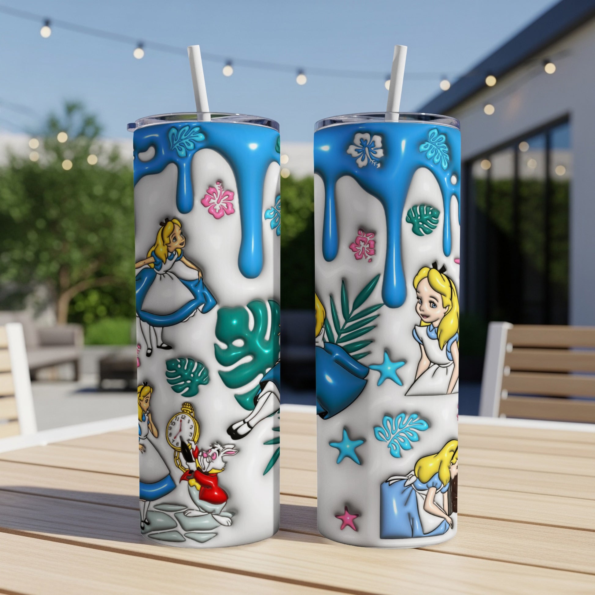 Alice in Wonderland characters on a white tumbler with blue drips and foliage.