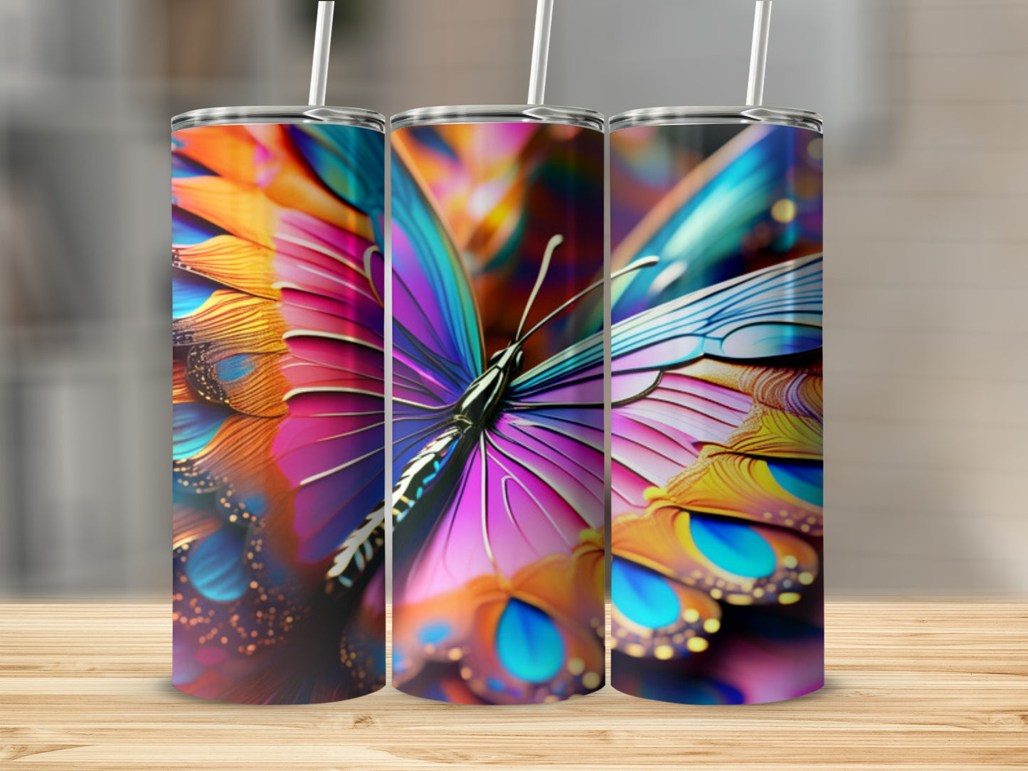 Three tumblers feature a colorful butterfly wing design with iridescent details.