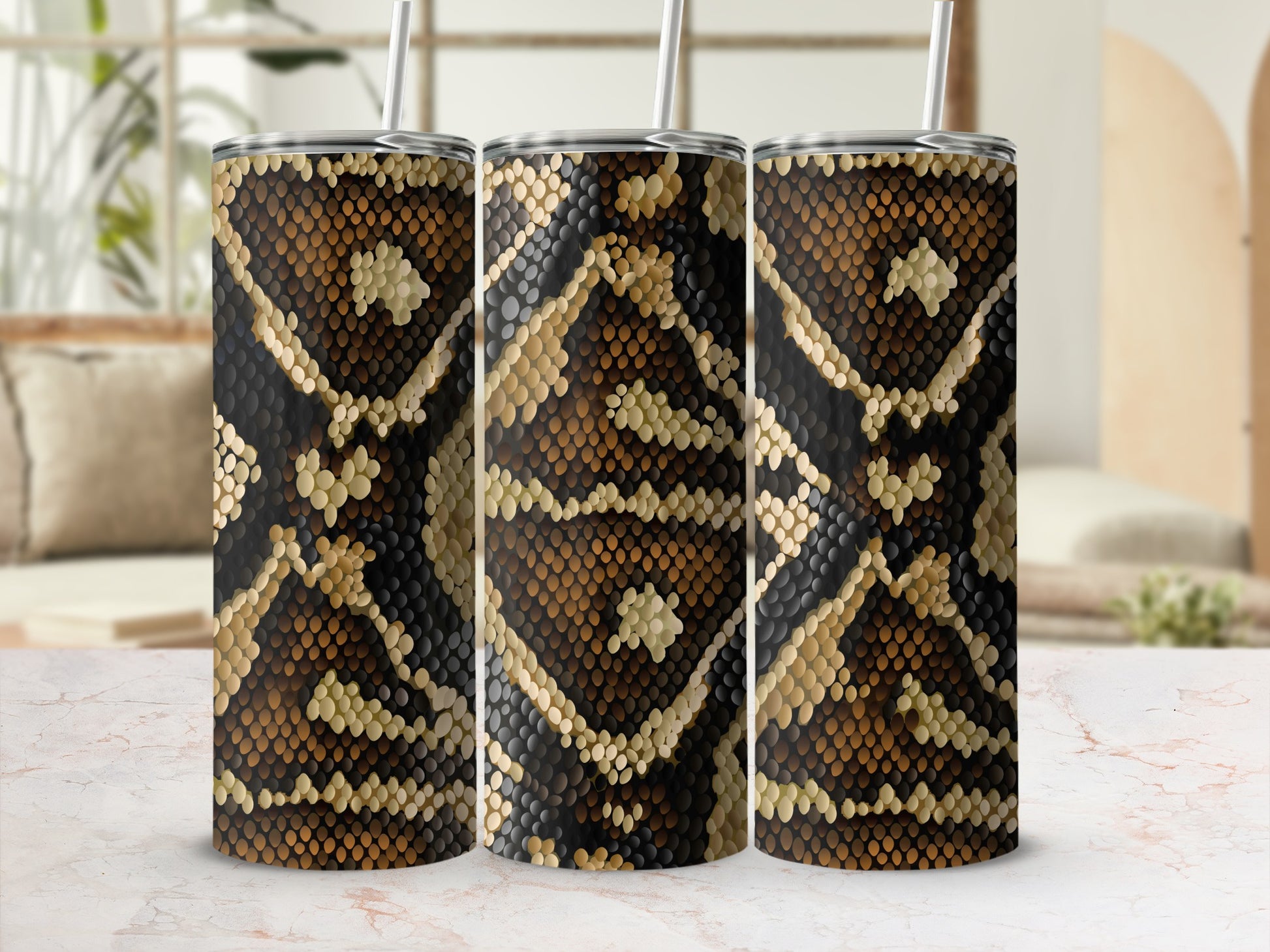 Three tumblers with a brown and black snakeskin pattern, each with a straw.