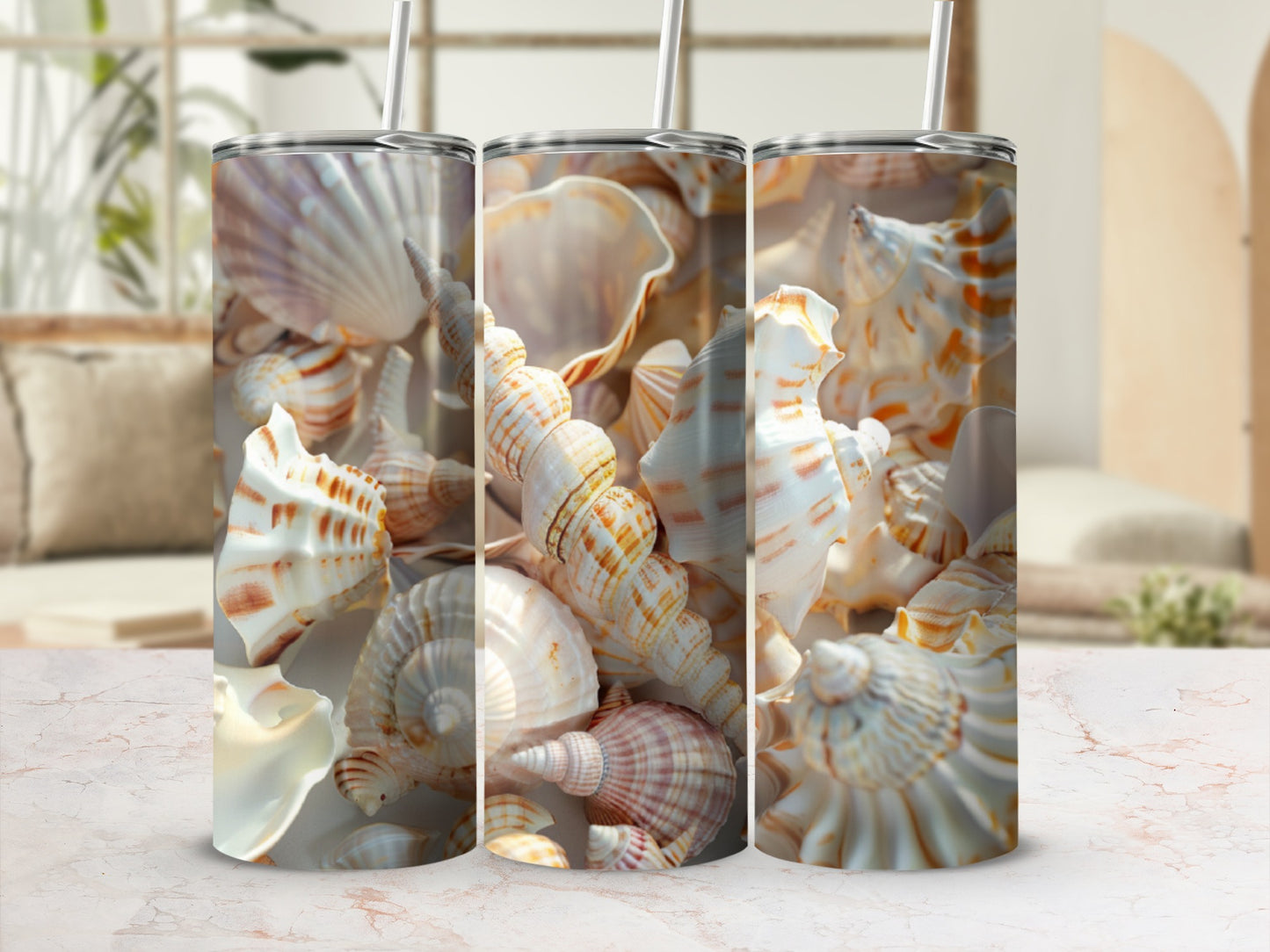 Triptych of tall tumblers featuring seashell patterns against a blurred beach background.